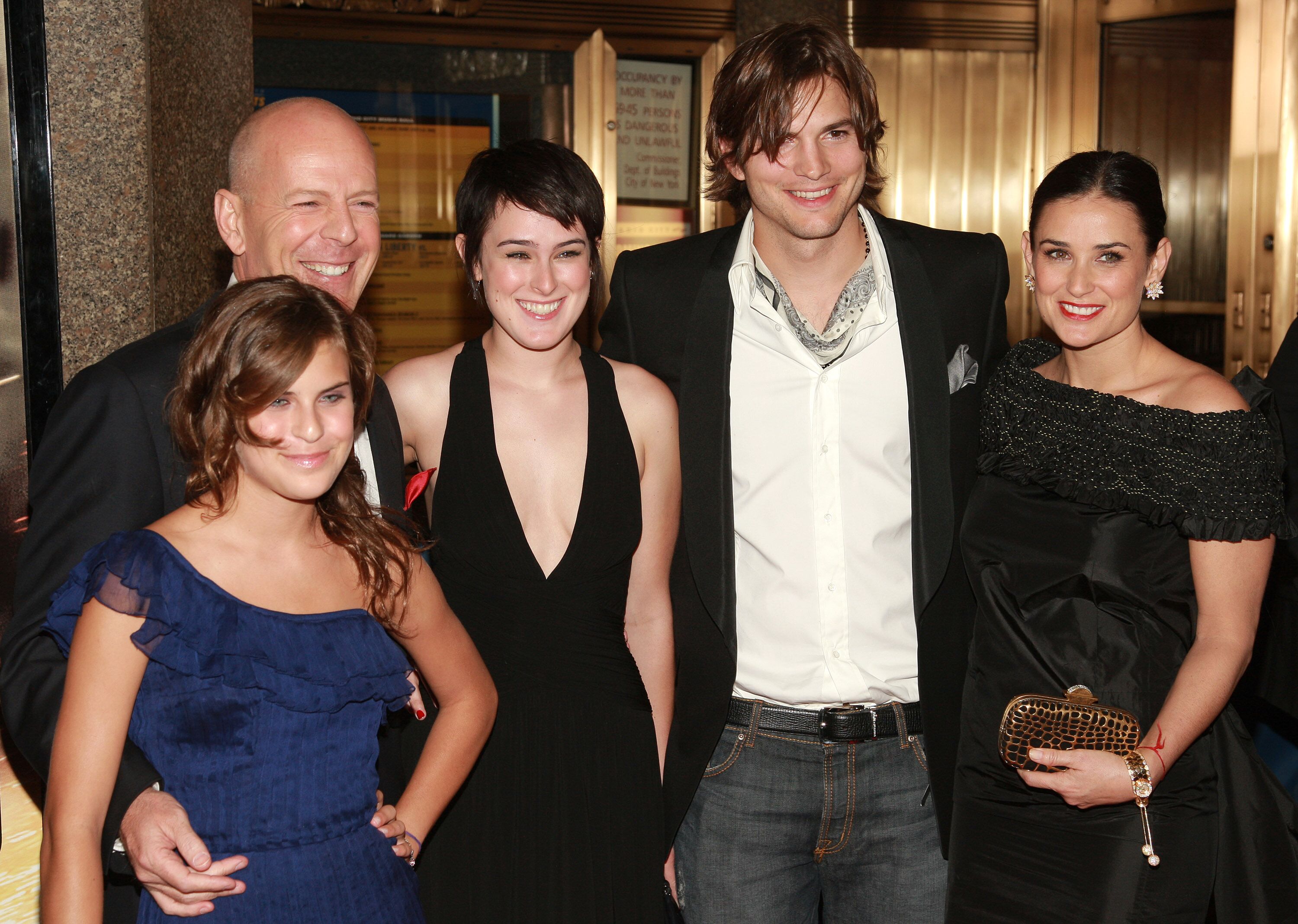 Ashton Kutcher, Demi Moore, and Bruce Willis pose with Rumer and Tallulah Willis at the premiere of Live Free Or Die Hard on June 22, 2007, in New York City | Photo: Evan Agostini/Getty Images