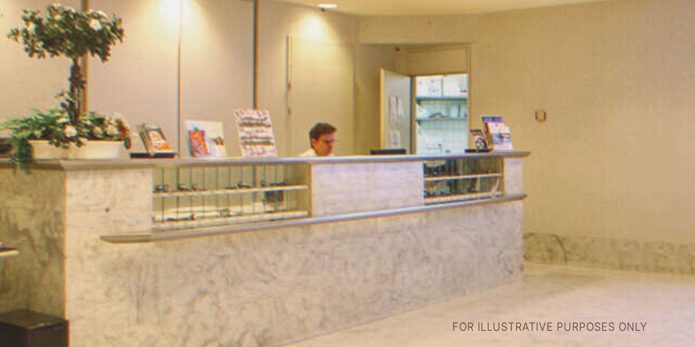 Hotel Manager Behind The Reception Desk. | Source: Flickr / fhotels (CC BY 2.0)