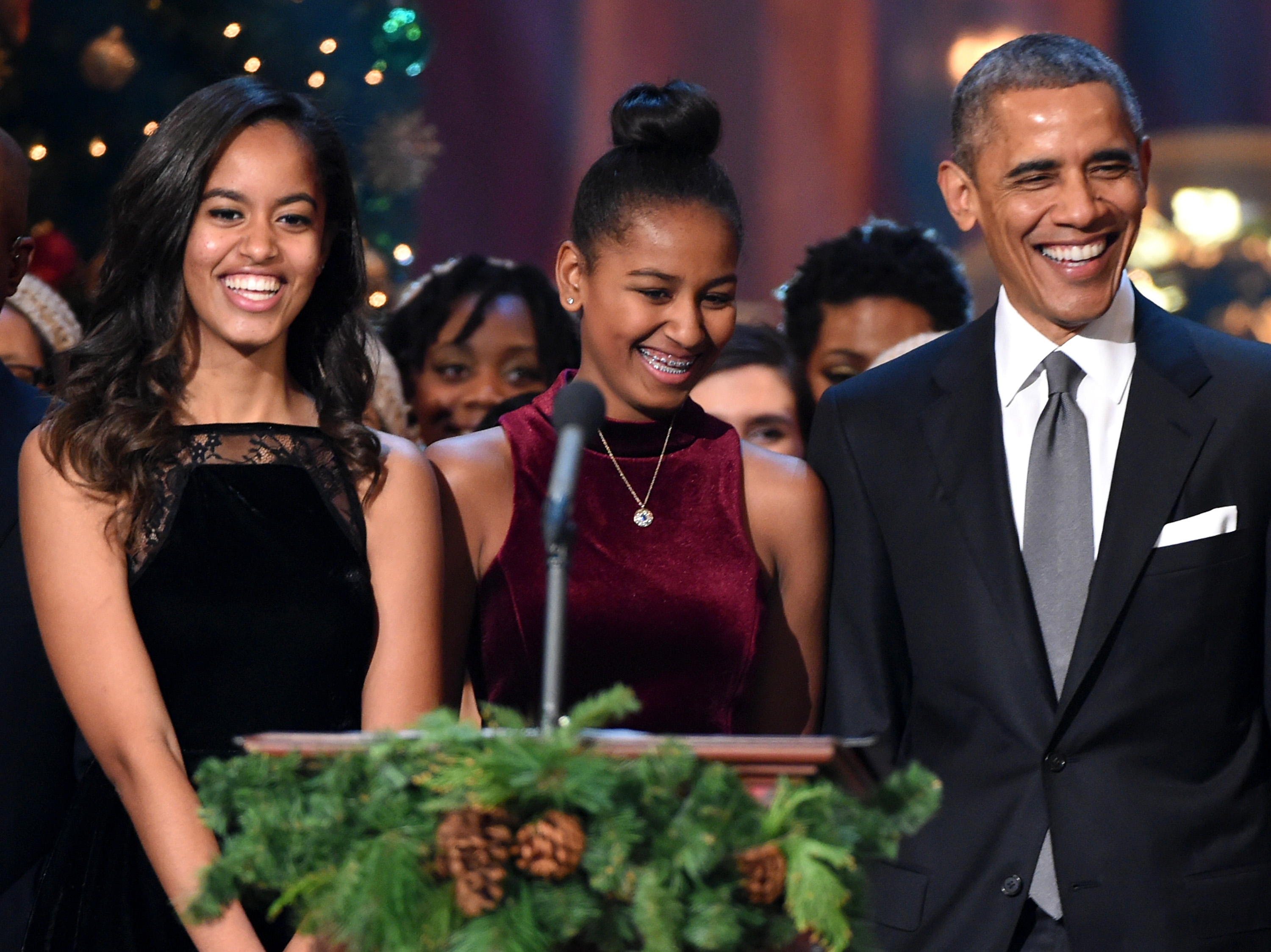 Malia Obama, Sasha Obama, and Barack Obama speak onstage at TNT Christmas in Washington 2014 at the National Building Museum on December 14, 2014 in Washington, DC.| Source: Getty Images