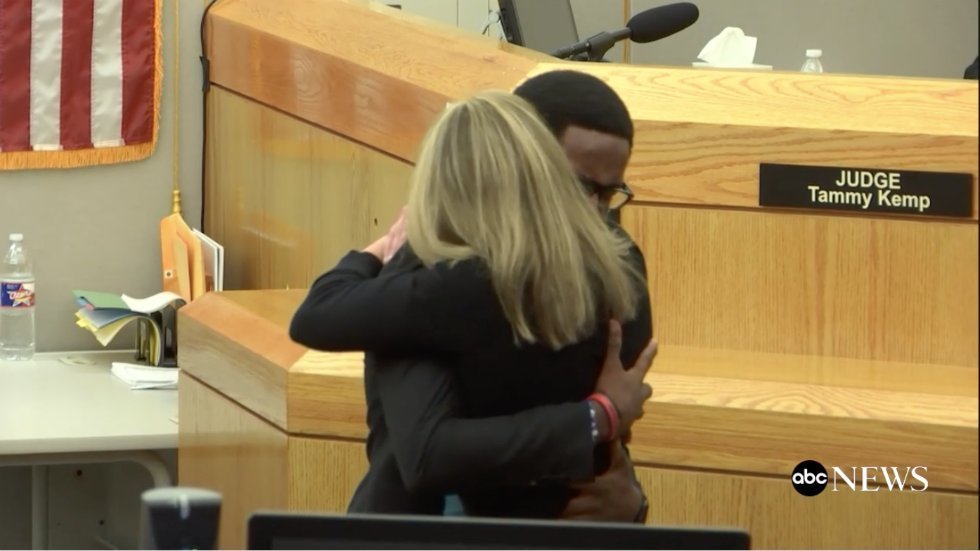 A screenshot of Brandt Jean hugging Amber Guyger at the Court Room after her Conviction | Source: Twitter / ABC News