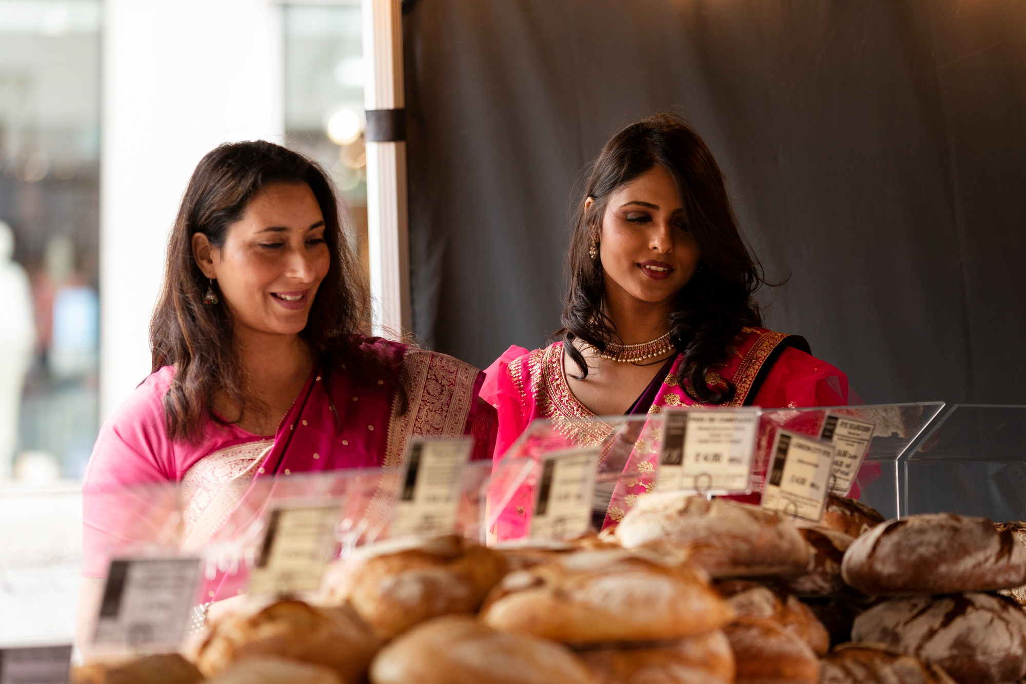 Two women at a bakery | Source: Freepik