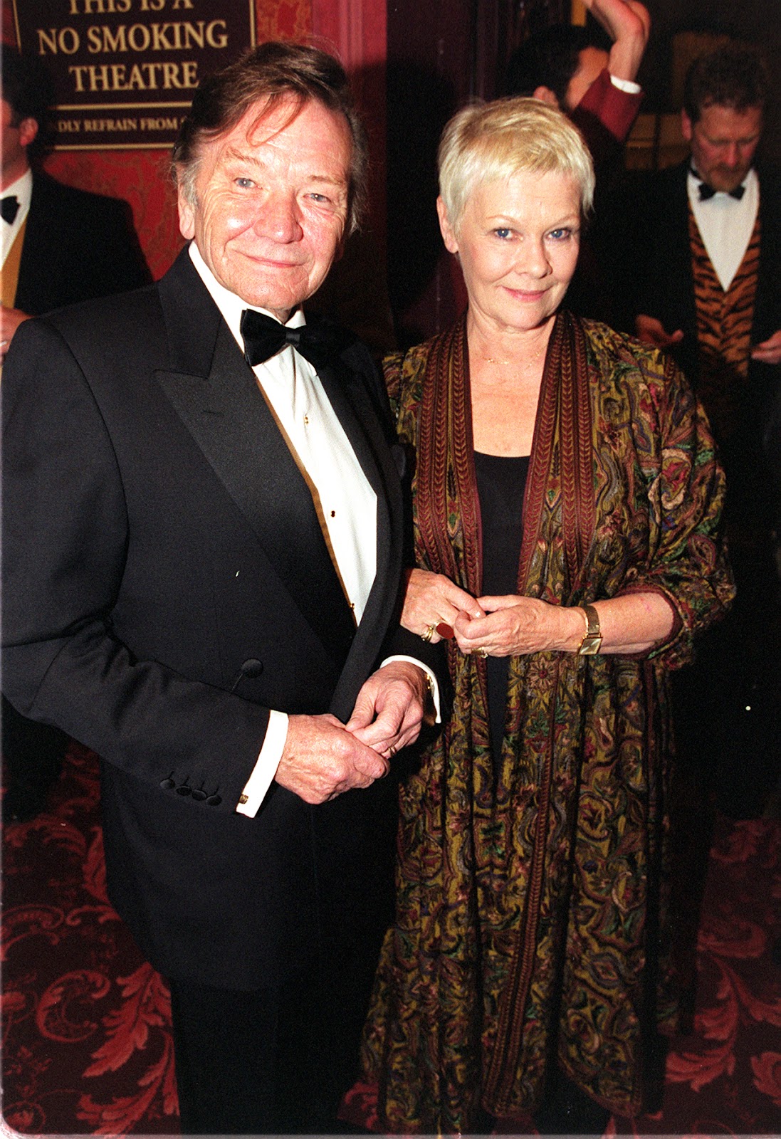 Michael Williams and Judi Dench at the London premiere of "The Lion King" in England in 1999. | Source: Getty Images