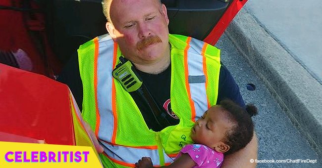 Touching photo of firefighter comforting little girl after car accident goes viral