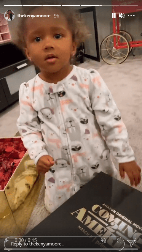 A screenshot from a clip of Brooklyn Daly adorably opening a box | Photo: Instagram/thekenyamoore