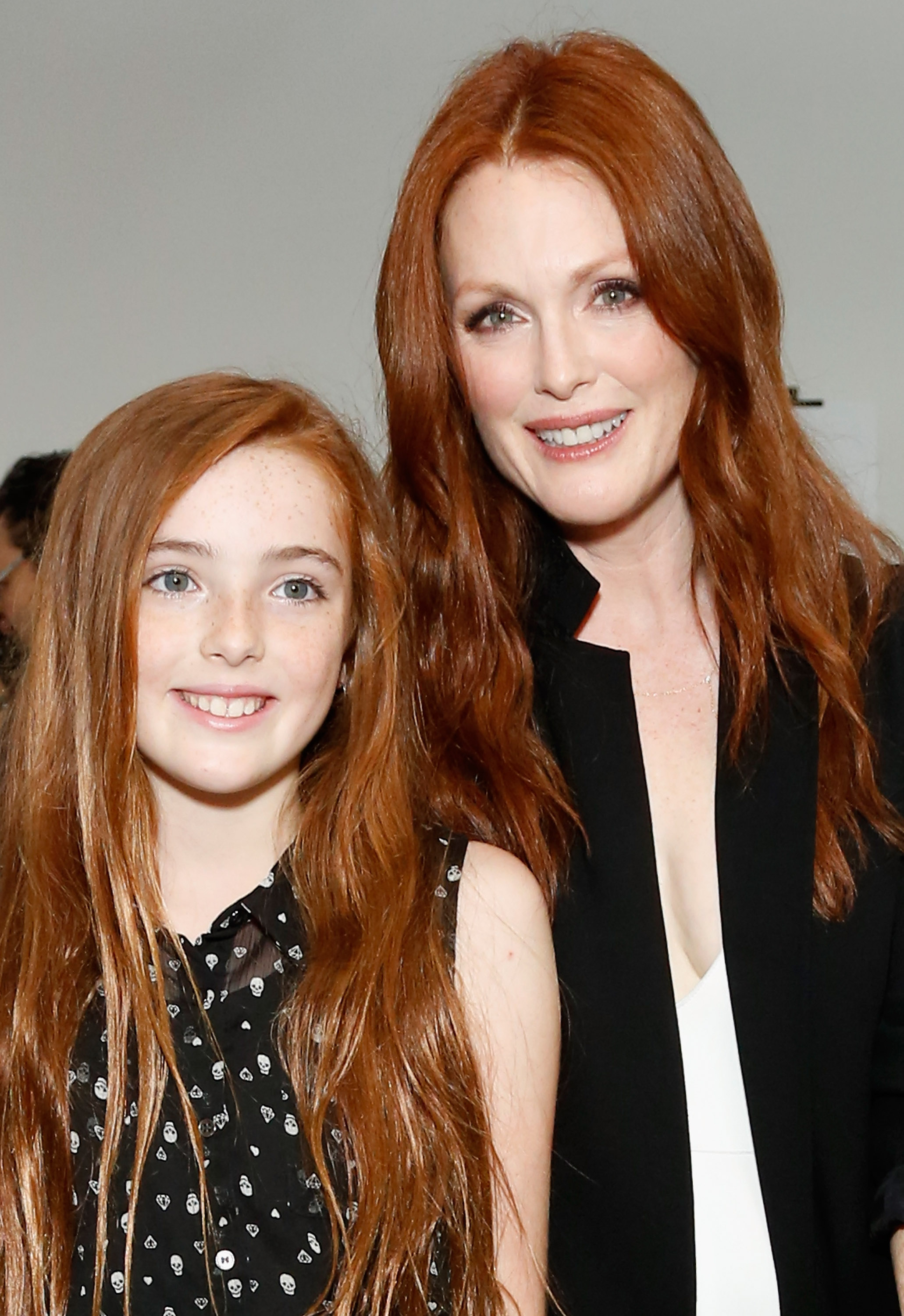 Julianne Moore and Liv Freundlich attend the Reed Krakoff fashion show on September 11, 2013 in New York City | Source: Getty Images
