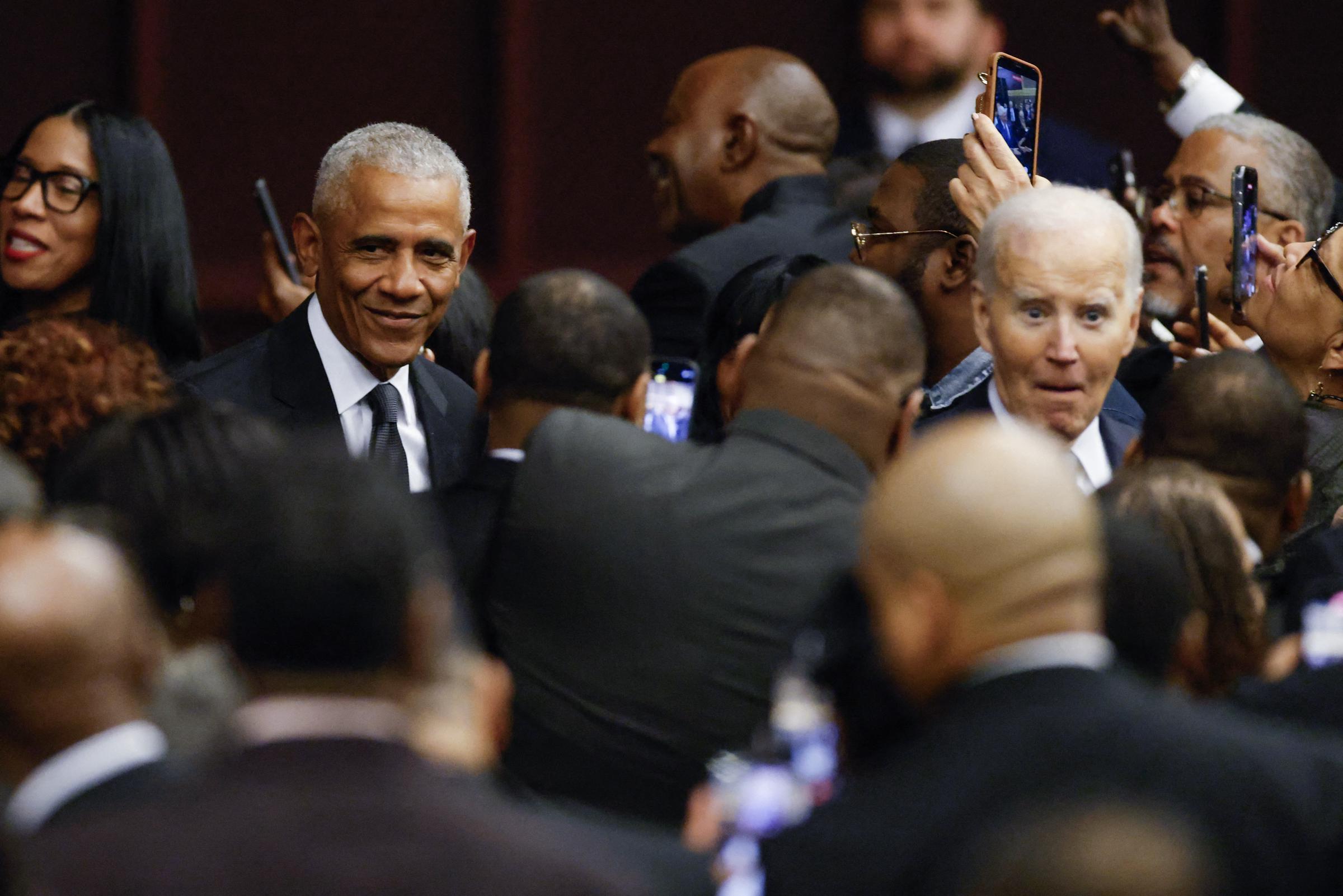Barack Obama and Joe Biden greet people as they arrive during a public memorial service to celebrate the life of civil rights activist Reverend Jesse Jackson in Chicago, Illinois, on March 6, 2026 | Source: Getty Images