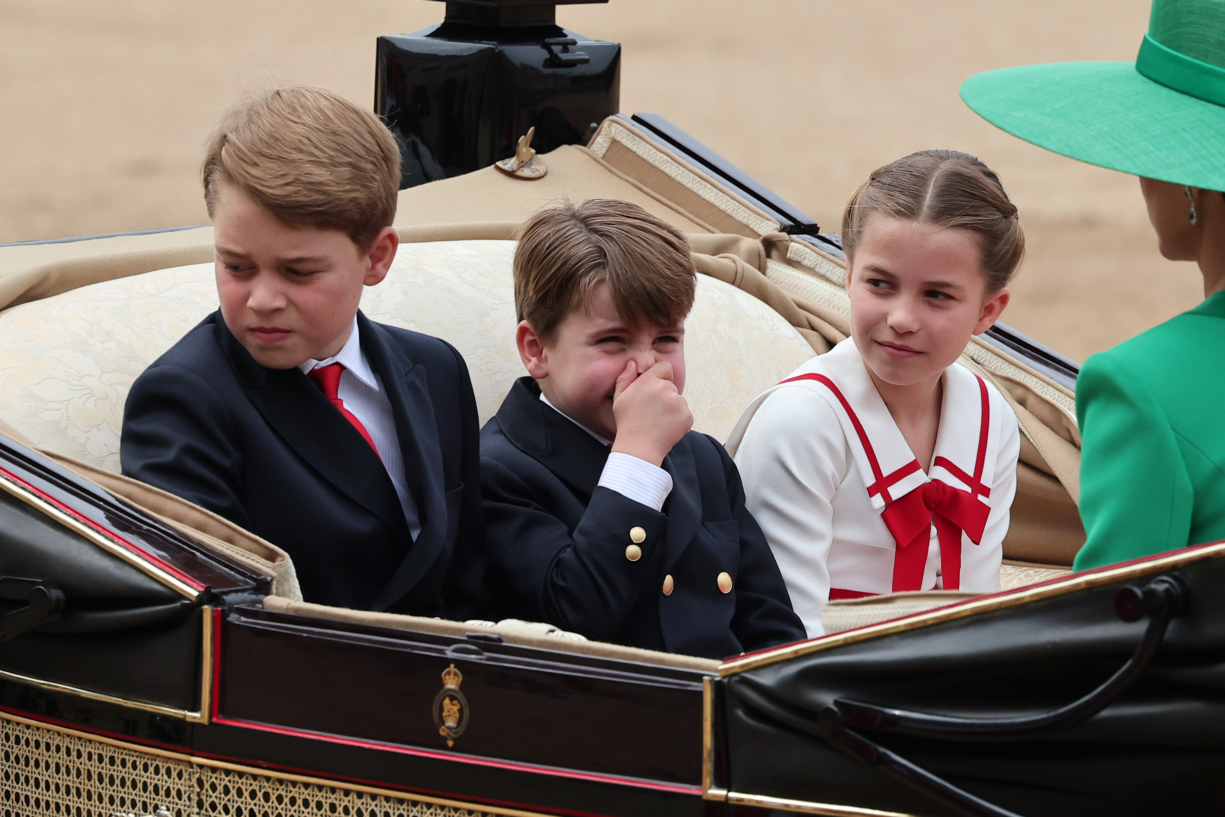 Prince George of Wales, Princess Charlotte of Wales, and Prince Louis of Wales ride in a horse drawn carriage during Trooping the Colour in London, England, on June 17, 2023. | Source: Getty Images