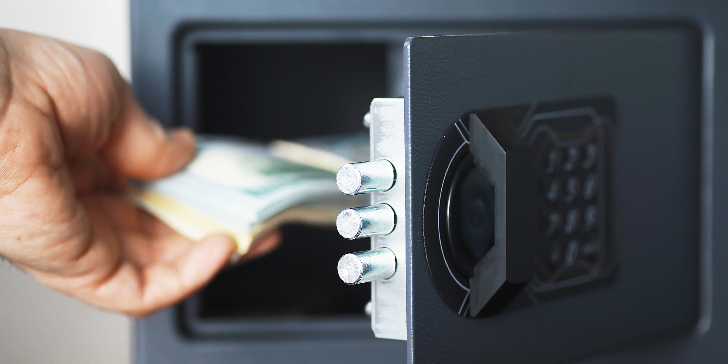 A person using a safe | Source: Shutterstock