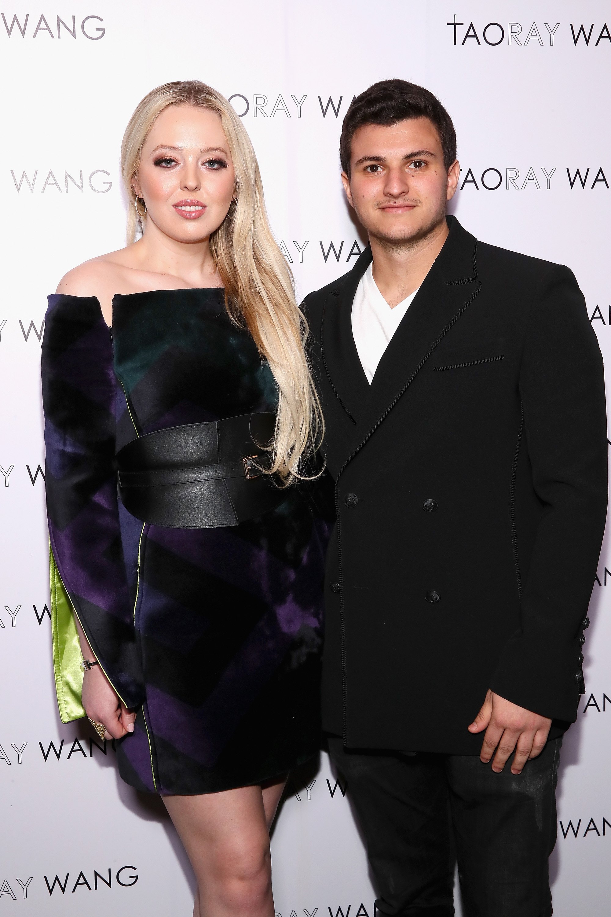 Internet personality Tiffany Trump and businessman Michael Boulos pose backstage for Taoray Wang fashion show during New York Fashion Week: The Shows at Gallery II at Spring Studios on February 9, 2019 in New York City ┃Source: Getty Images