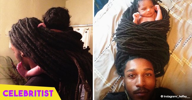 Adorable photo of baby wrapped in her father's locs go viral