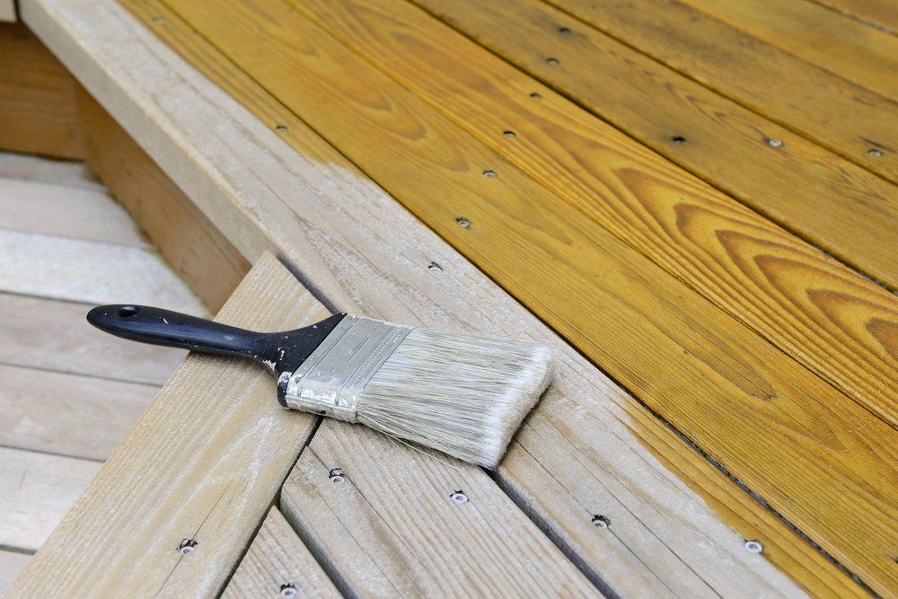 A photo of a cedar porch being painted. | Photo: Shutterstock.