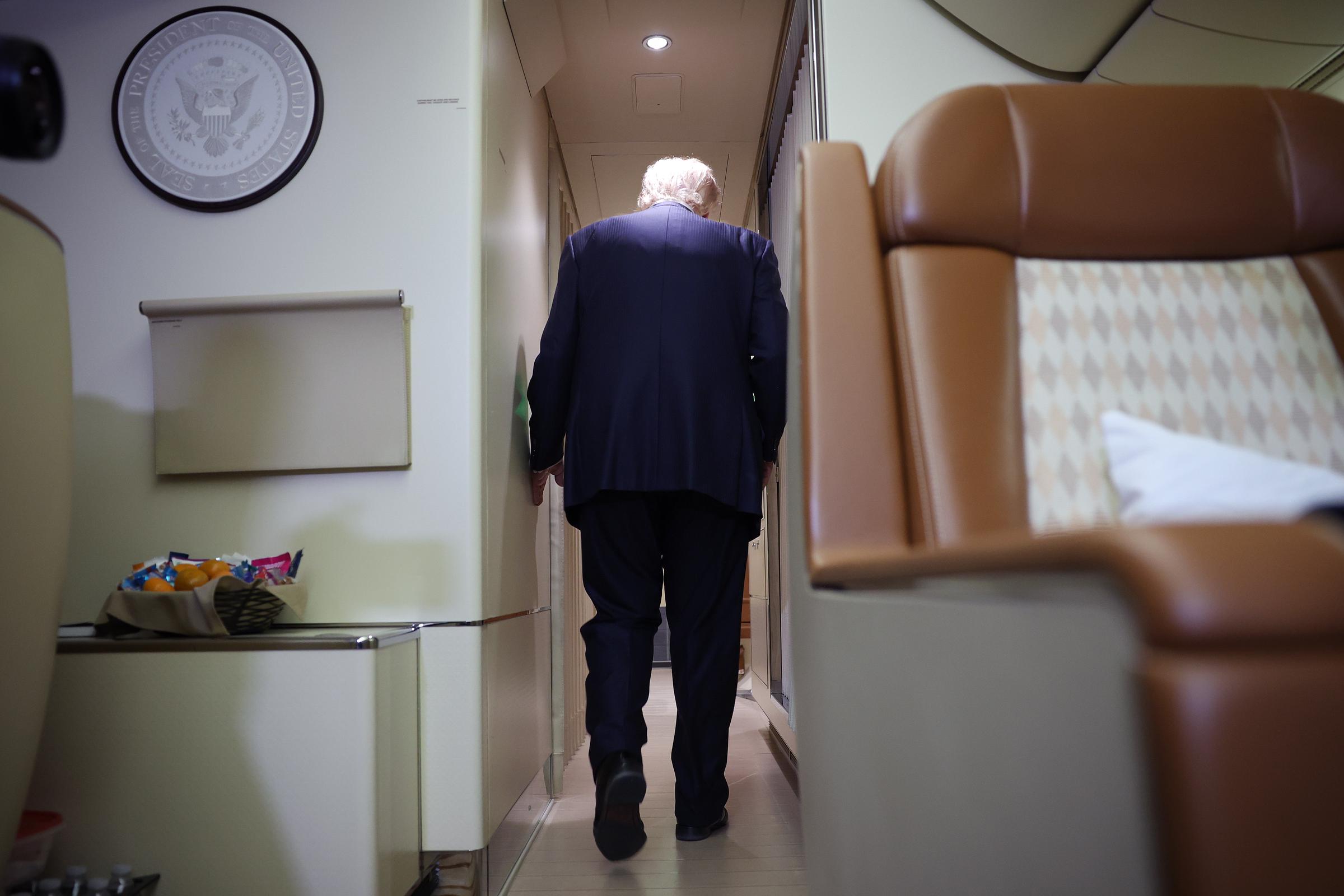 Reporters later questioned Trump about why window shades had been ordered closed during the flight from Turkey. He replied that they were "probably on a dangerous flight" because of the people the U.S. had to deal with. | Source: Getty Images