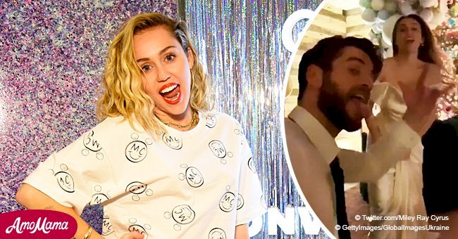 Miley Cyrus bares her shoulders in plunging slinky dress while dancing in a post-wedding video