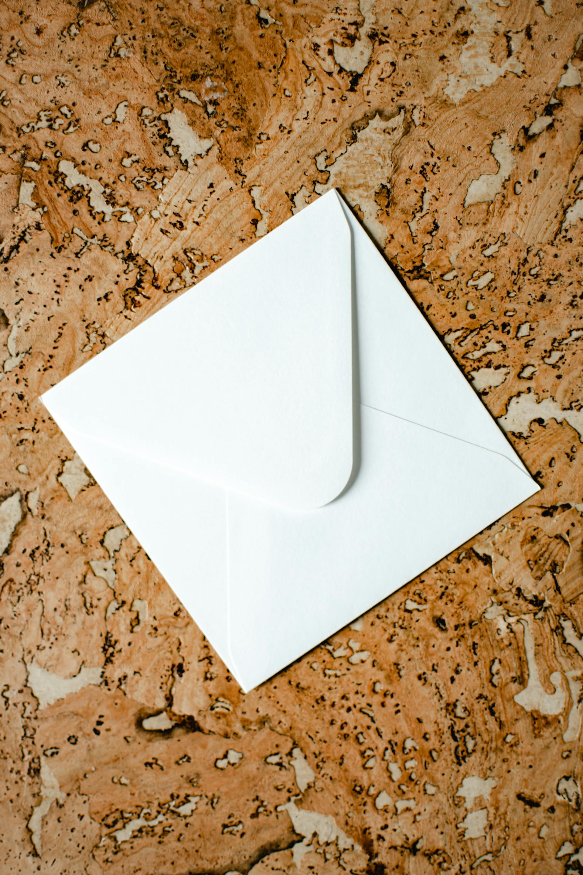 A white envelope lying on a table | Source: Pexels