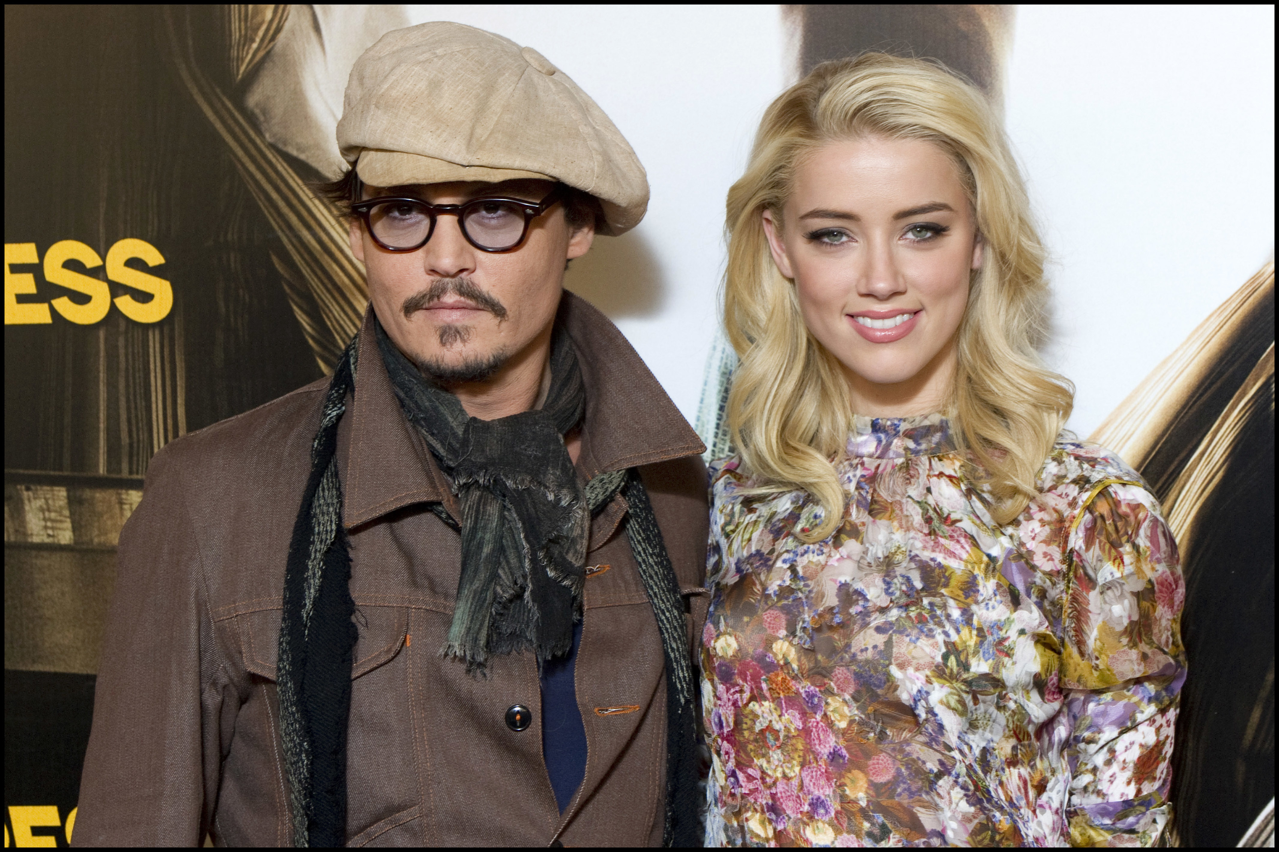 Johnny Depp and Amber Heard attend the "Rum Express" (Rum Diary) photocall on November 8, 2011 in Paris | Source: Getty Images