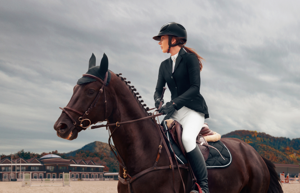 A woman riding a horse | Source: Shutterstock