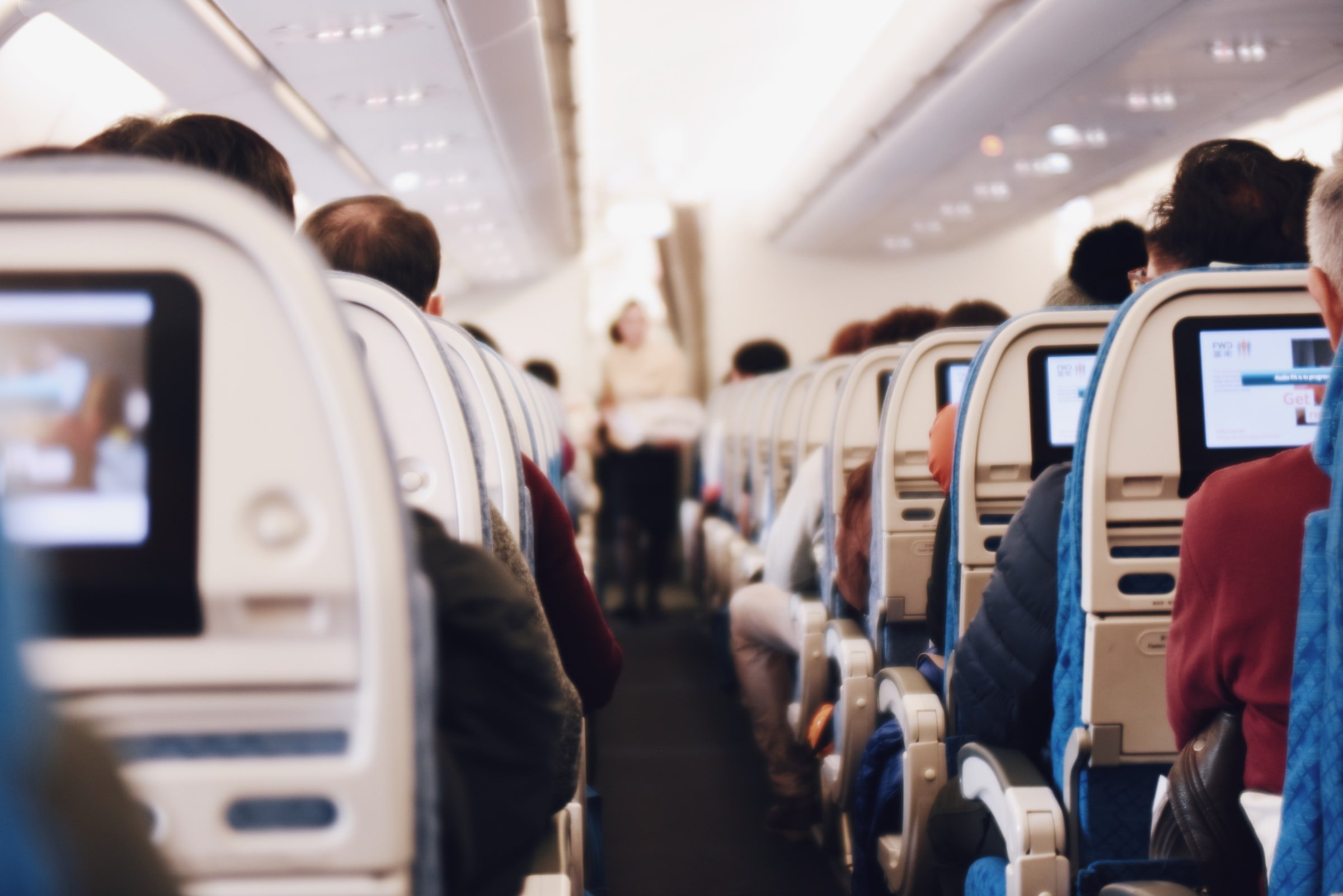 Passengers in an airplane. | Source: Unsplash