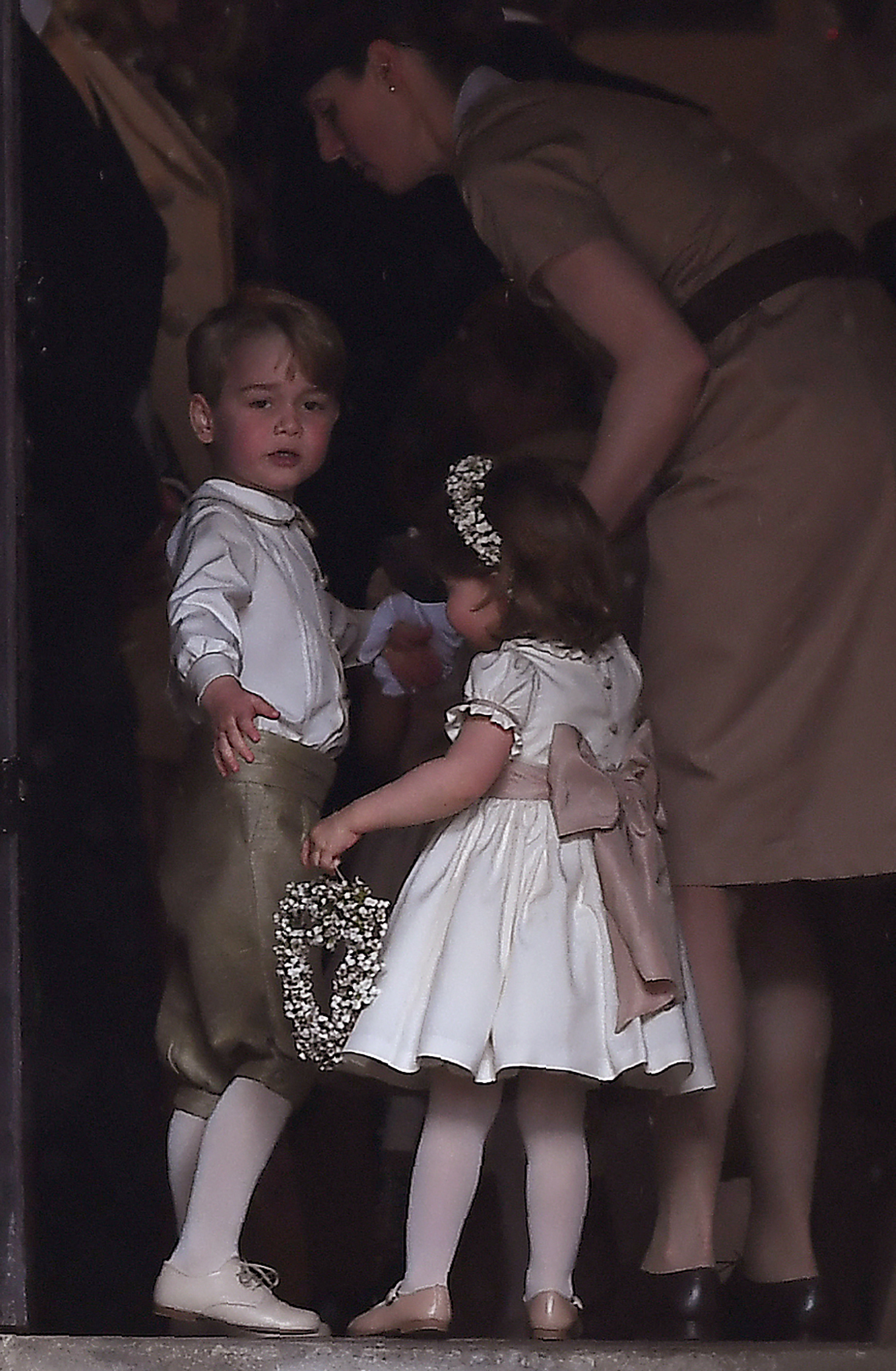 Maria Borrallo, Prince George, and Princess Charlotte the wedding of their aunt Pippa Middleton to James Matthews at St Mark's Church in Englefield, West of London, on May 20, 2017 | Source: Getty Images
