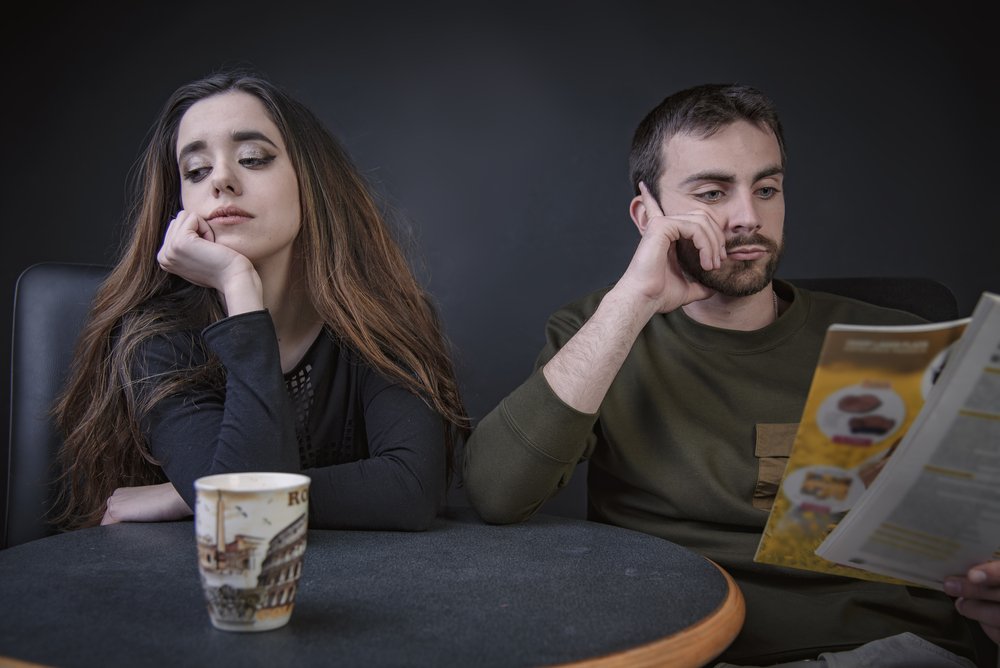 A photo of a young alienated couple at home. | Photo: Shutterstock