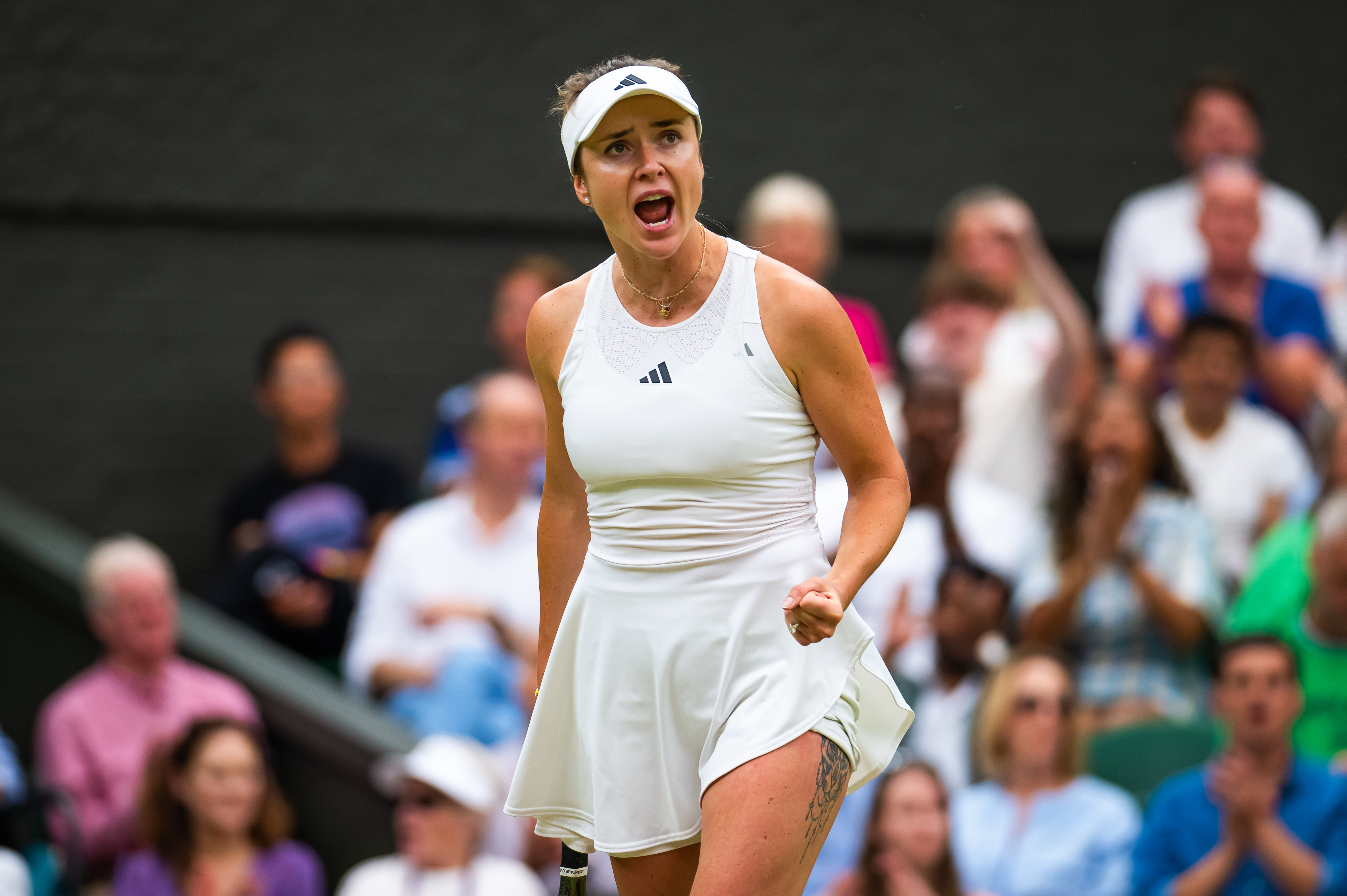 Elina Svitolina of Ukraine in action against Iga Swiatek of Poland in the quarter-final during Day Nine of The Championships Wimbledon 2023 at All England Lawn Tennis and Croquet Club on July 10, 2023, in London, England. | Source: Getty Images