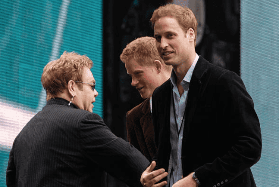 Elton John greets and has a chat with Prince Harry and Prince William on stage during the "Concert for Diana" held at Wembley Stadium, on July 1, 2007,  London, England | Source: Edmond Terakopian/NBCU Photo Bank/NBCUniversal via Getty Images