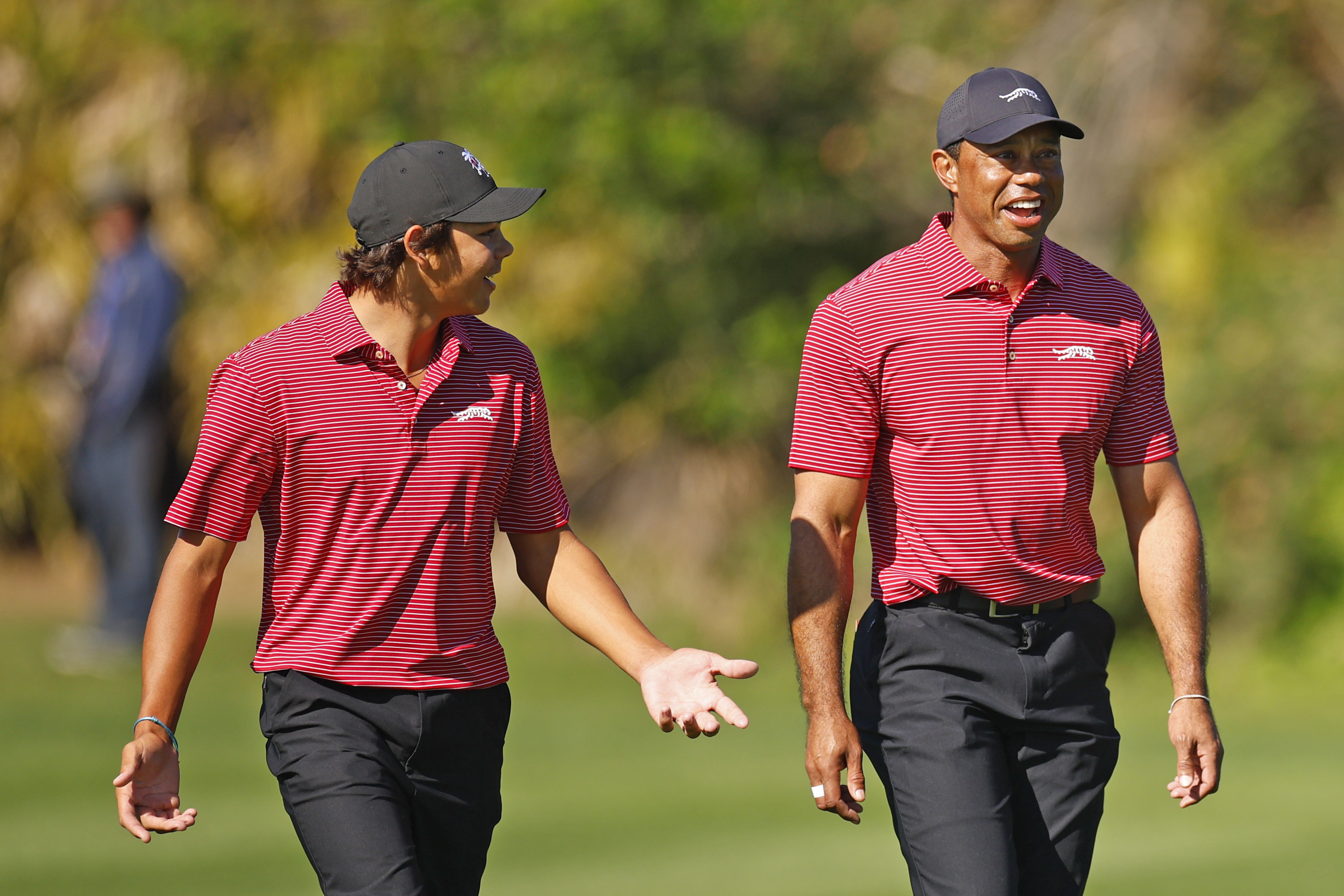 Tiger Woods and his son Charlie walk the fourth hole during the second round of the 2024 PNC Championship in Orlando on December 22, 2024 | Source: Getty Images