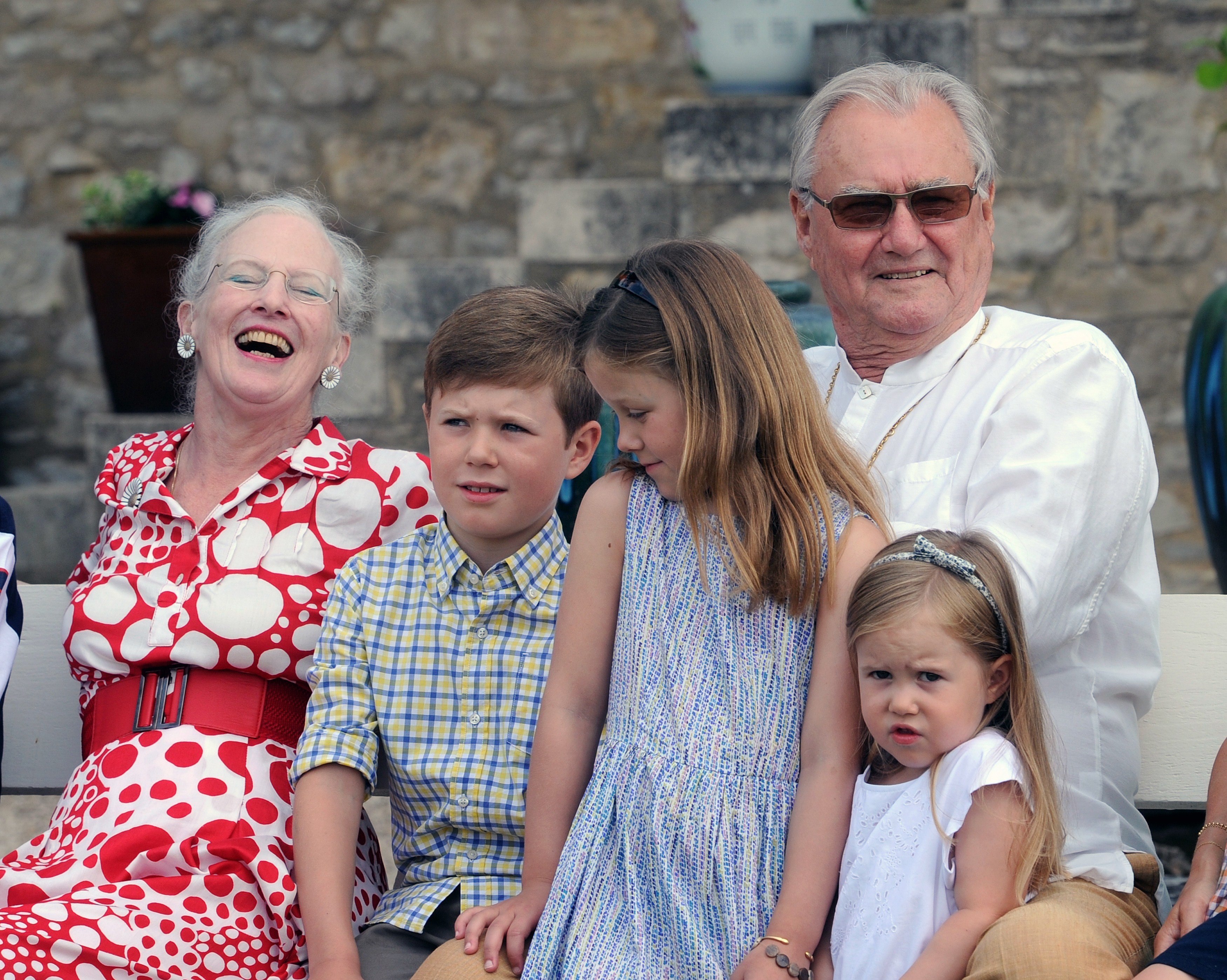Danish Queen Margrethe II and Prince Henrik pose with some of their grandchildren on June 11, 2014, in the gardens of their chateau at Caïx. | Source: Getty Images