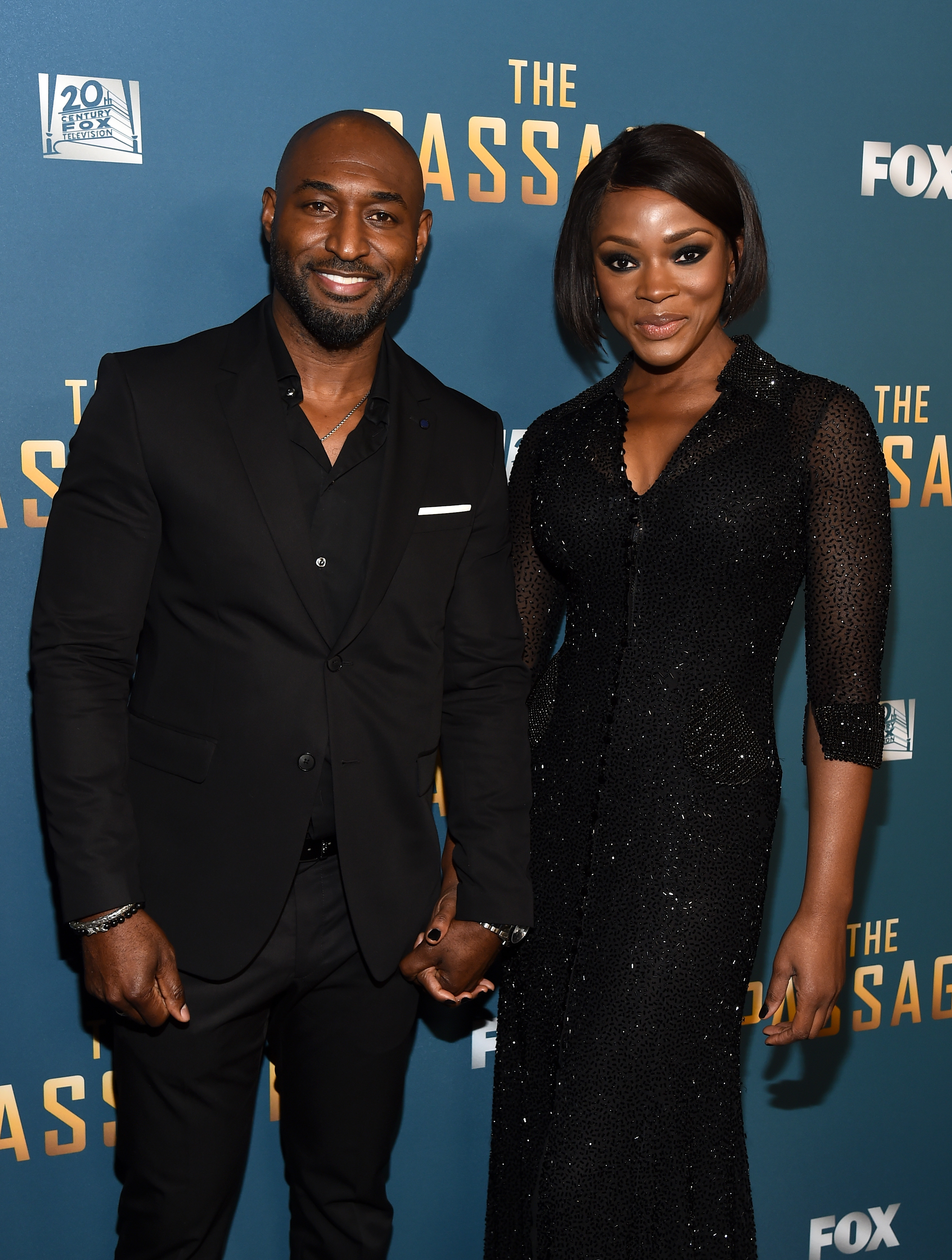 Adrian Holmes and Caroline Chikezie at the premiere of "The Passage" on January 10, 2019, in in Los Angeles. | Source: Getty Images