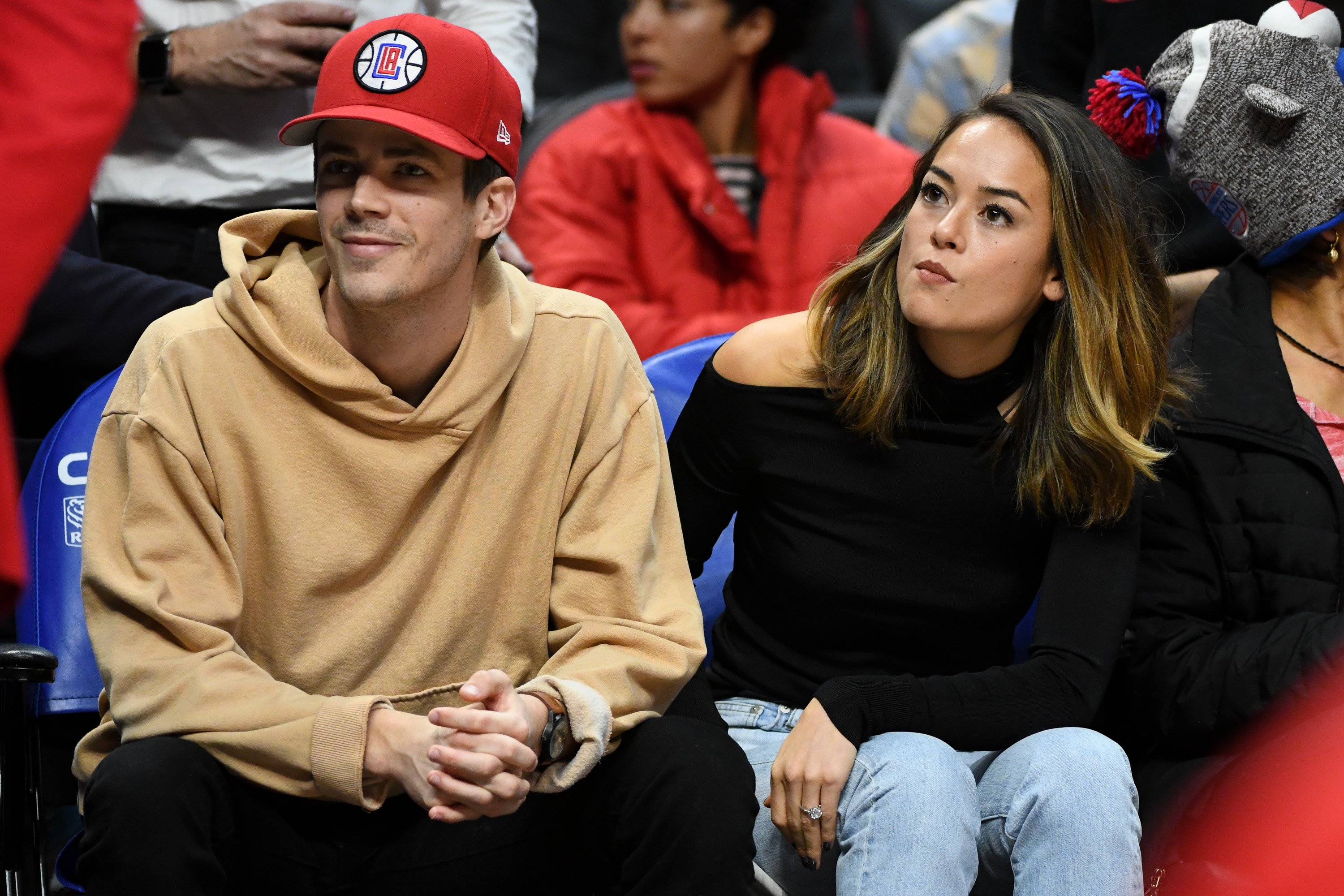 Grant Gustin and Andrea "LA" Thoma attend a basketball game between the Los Angeles Clippers and the Minnesota Timberwolves in Los Angeles | Source: Getty Images