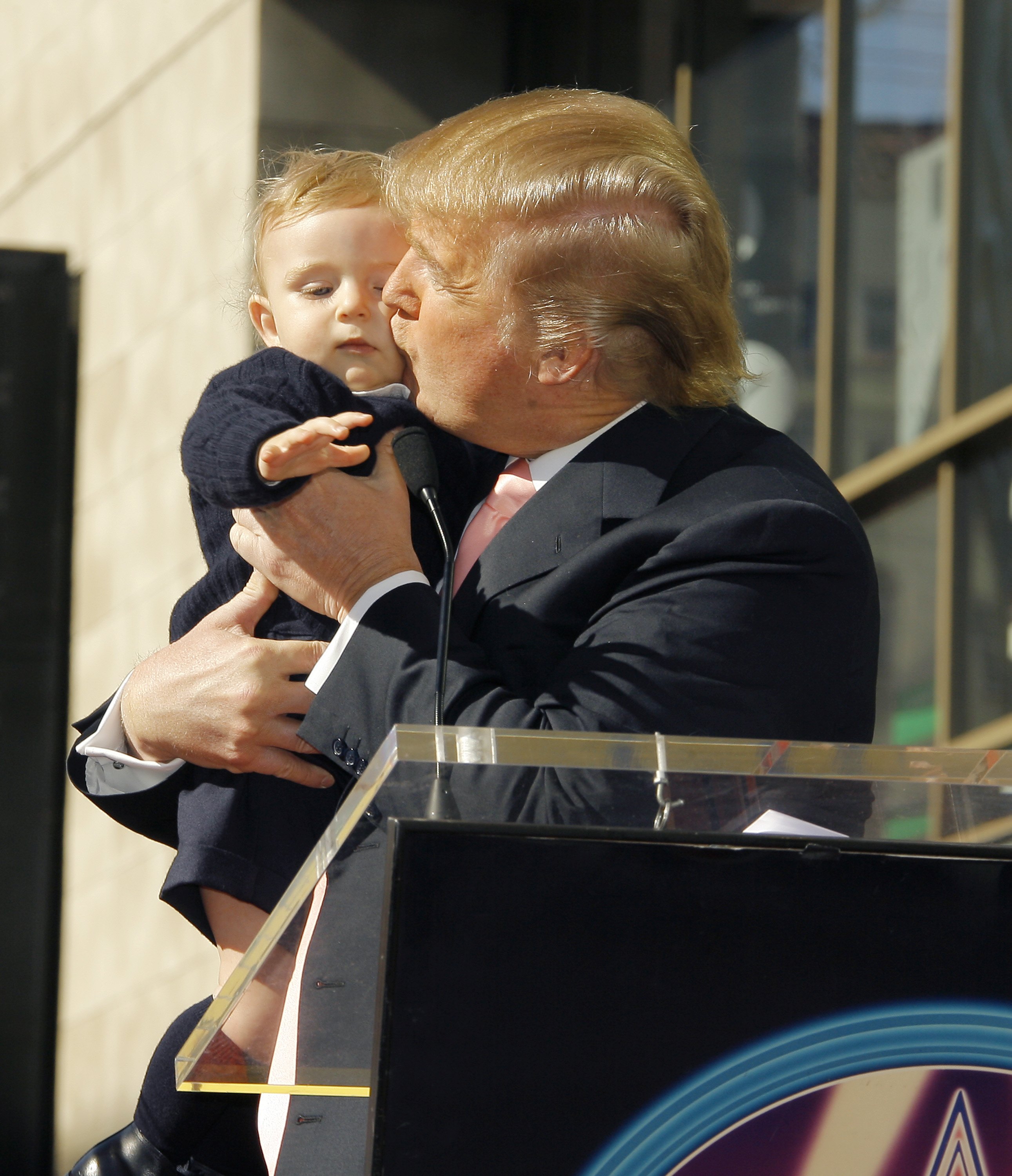 Baby Barron and Donald Trump at the ceremony honoring Donald Trump with a star on the Hollywood Walk of Fame on January 16, 2006, in Hollywood, California. | Source: Getty Images