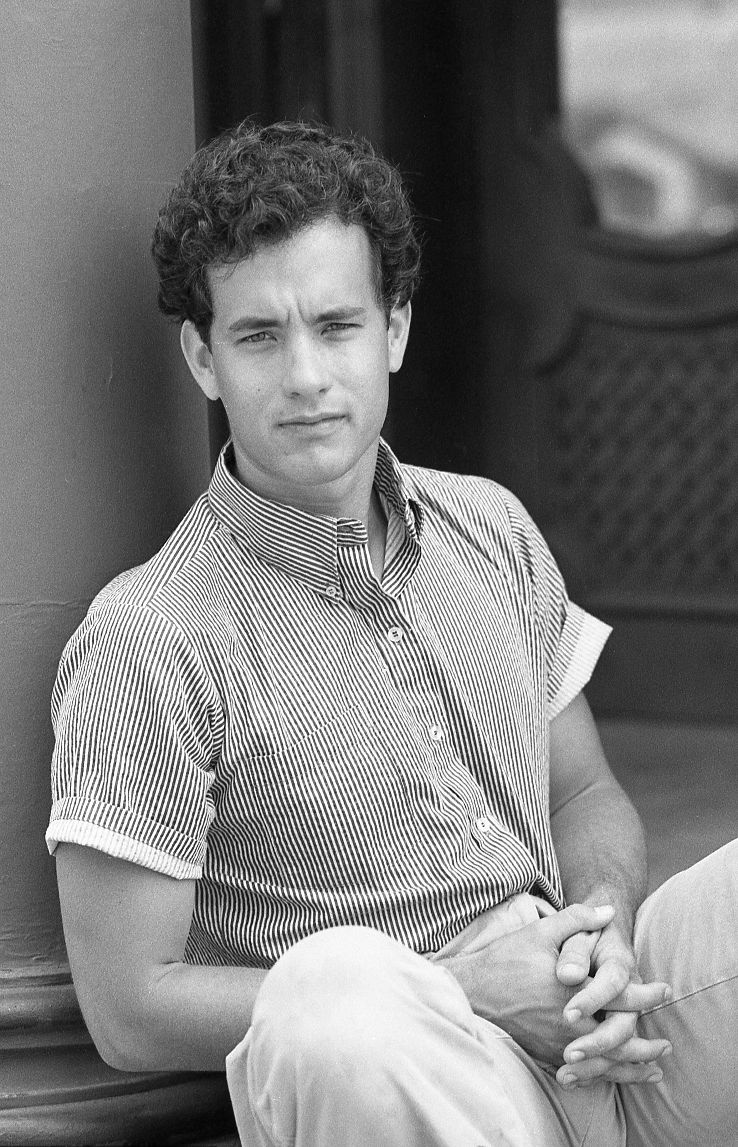 Tom Hanks poses during the filming of the movie "Bachelor Party" on the backlot of 20th Century Fox Studio in 1984 in Century City, California ┃Source: Getty Images