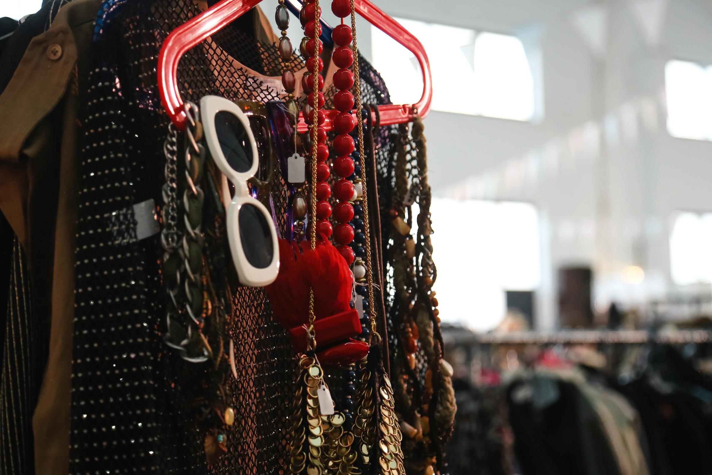 Accesories hanging on a clothes hanger | Source: Getty Images