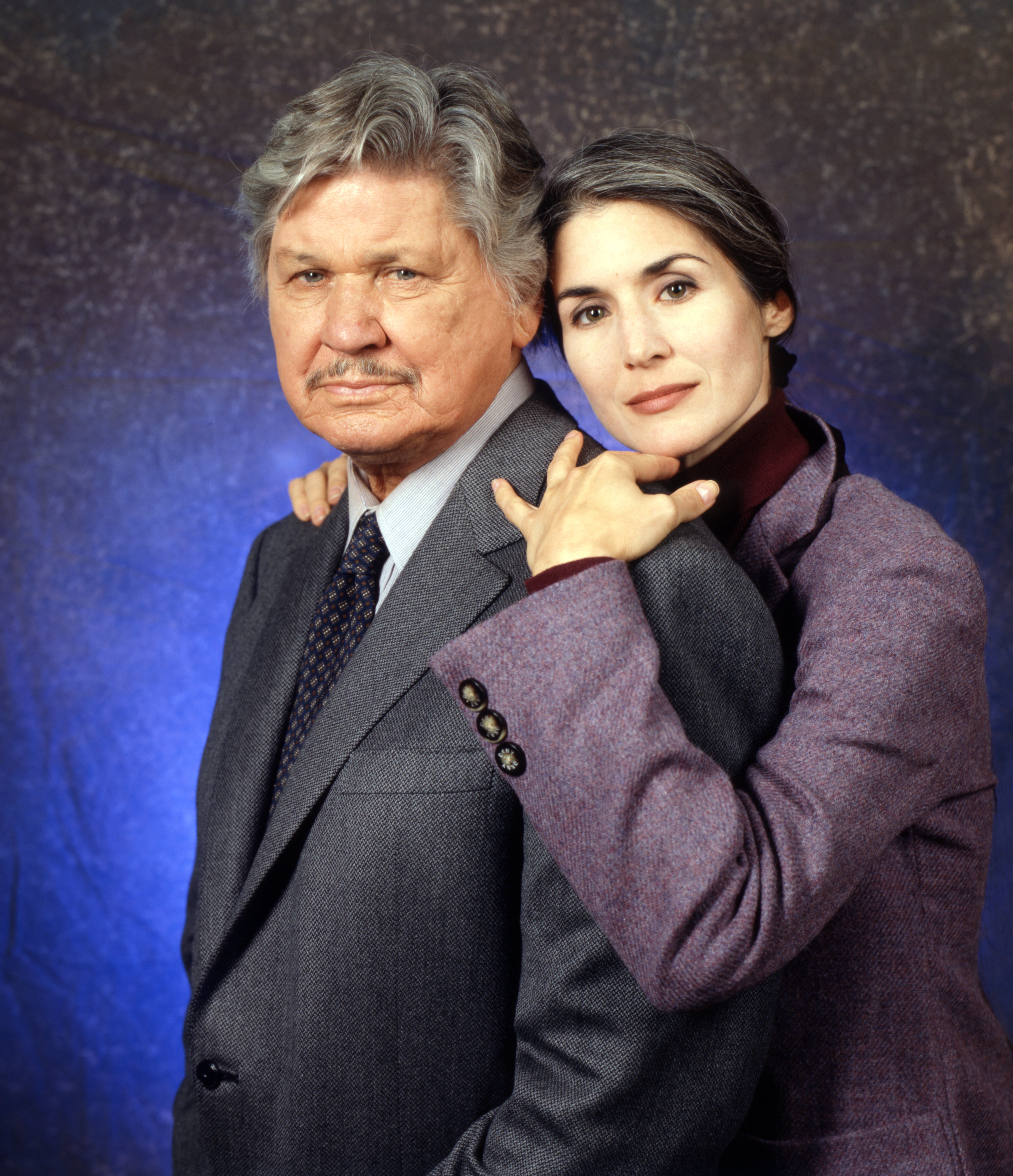 Charles Bronson as Paul Fein pictured with his wife, actress Kim Weeks as Anna Meyer in "Breach of Faith : A Family of Cops II," aired on February 2, 1997. / Source: Getty Images