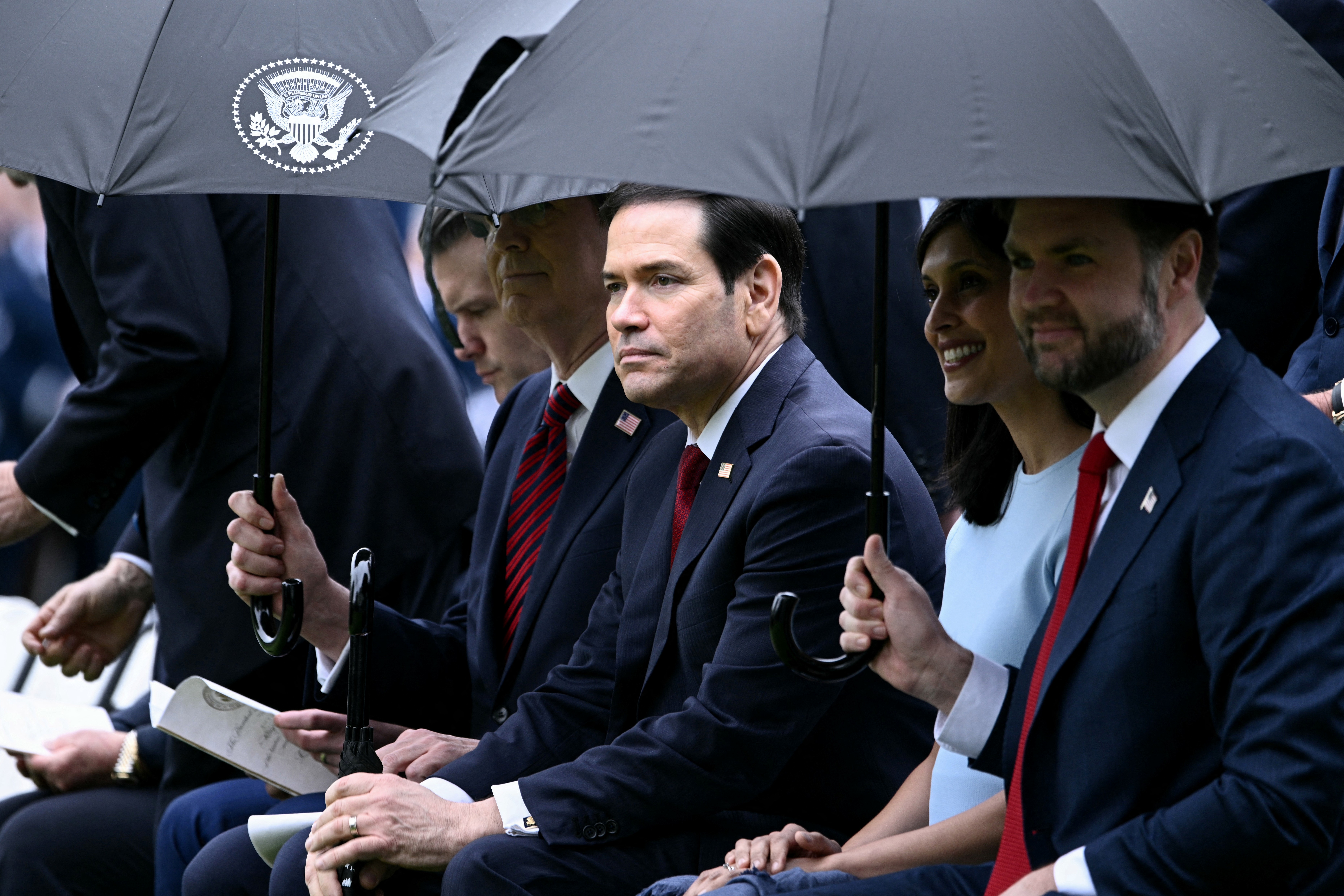 Vice President JD Vance, Second Lady Usha Vance, Secretary of State Marco Rubio, and Defense Secretary Pete Hegseth await Donald Trump and Melania Trump as they welcome King Charles III and Queen Camilla at the White House South Lawn, April 28, 2026. | Source: Getty Images