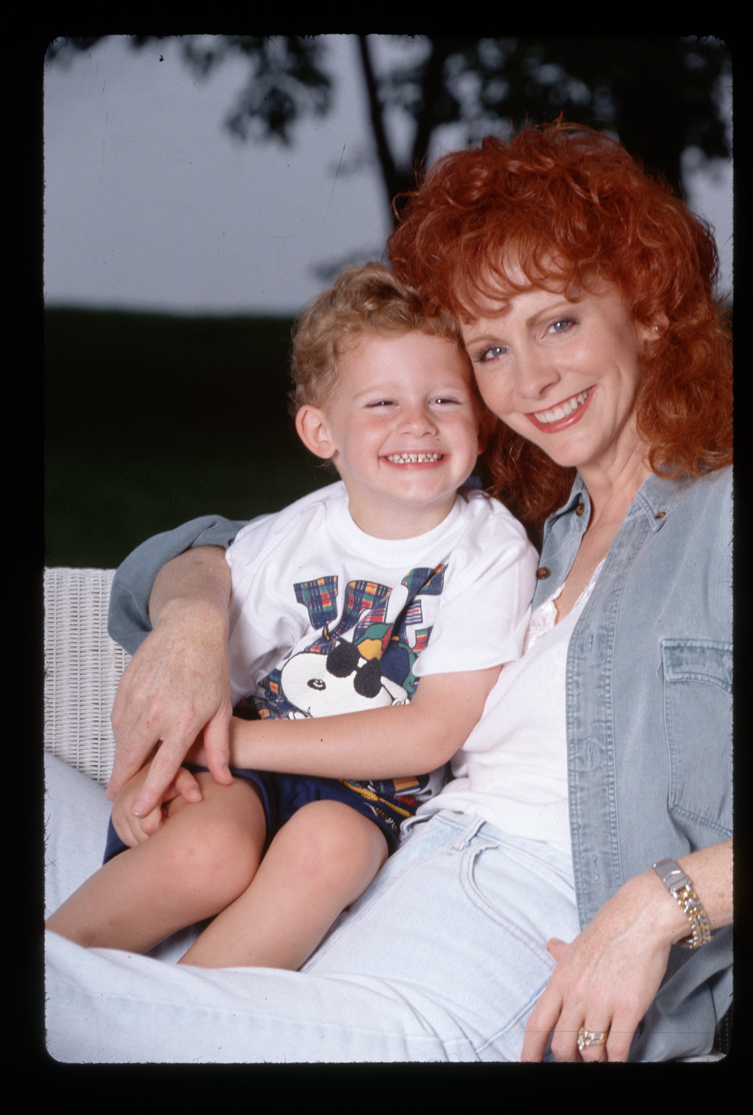 Reba McEntire hugs her young son Shelby Steven McEntire Blackstock, circa 1994 | Source: Getty Images