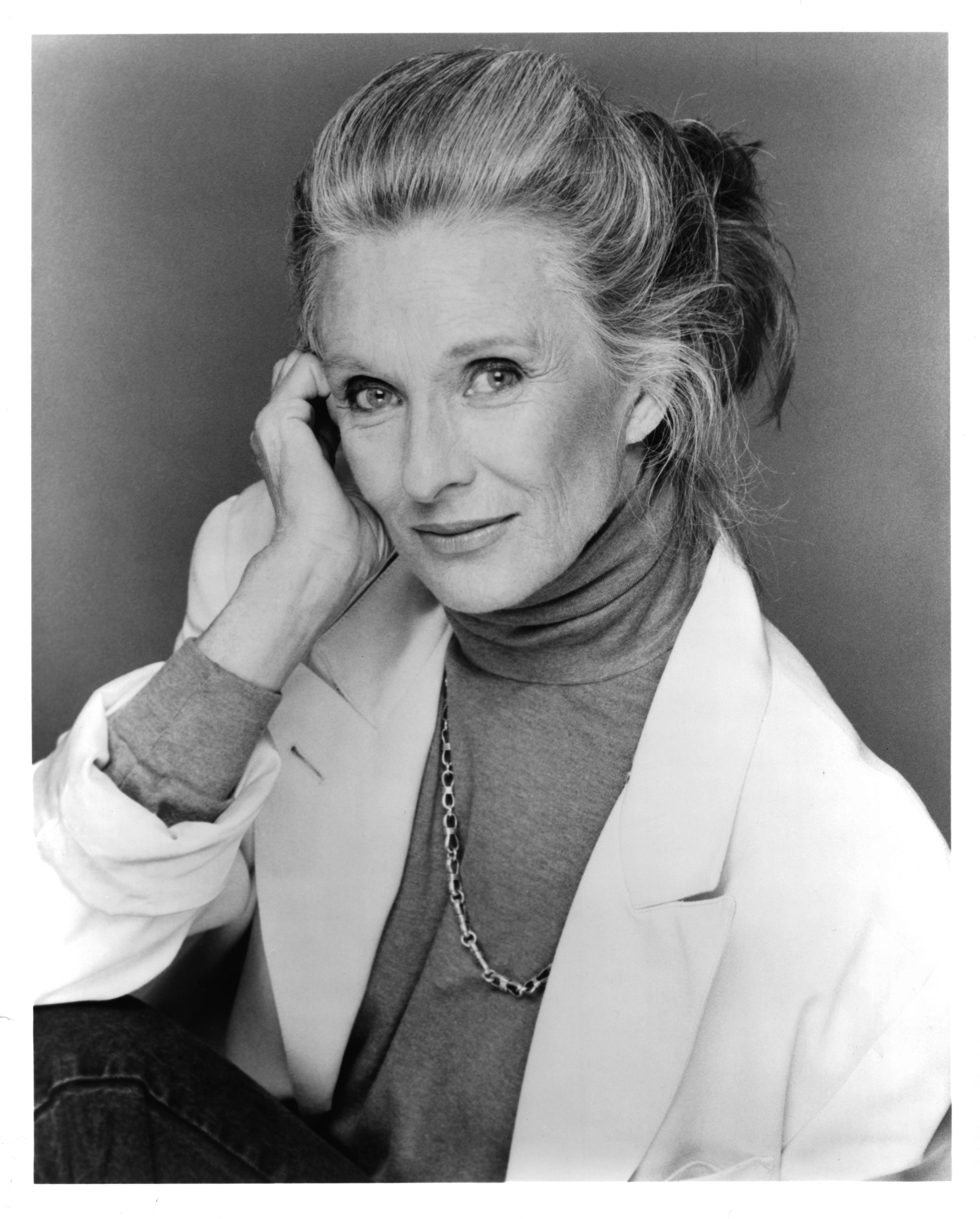 Cloris Leachman posing for a portrait while wearing in a blazer paired with a turtle neck in 1985. / Source: Getty Images