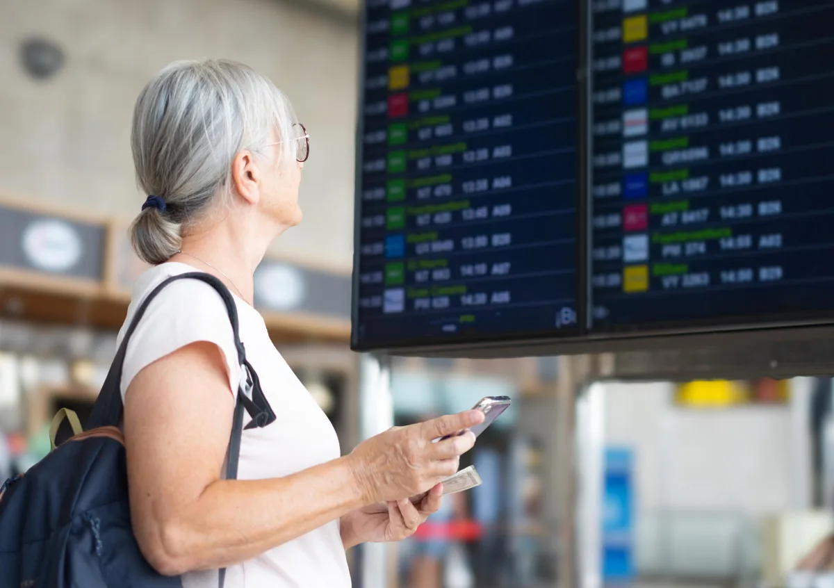A woman looking for her boarding gate | Source: Shutterstock