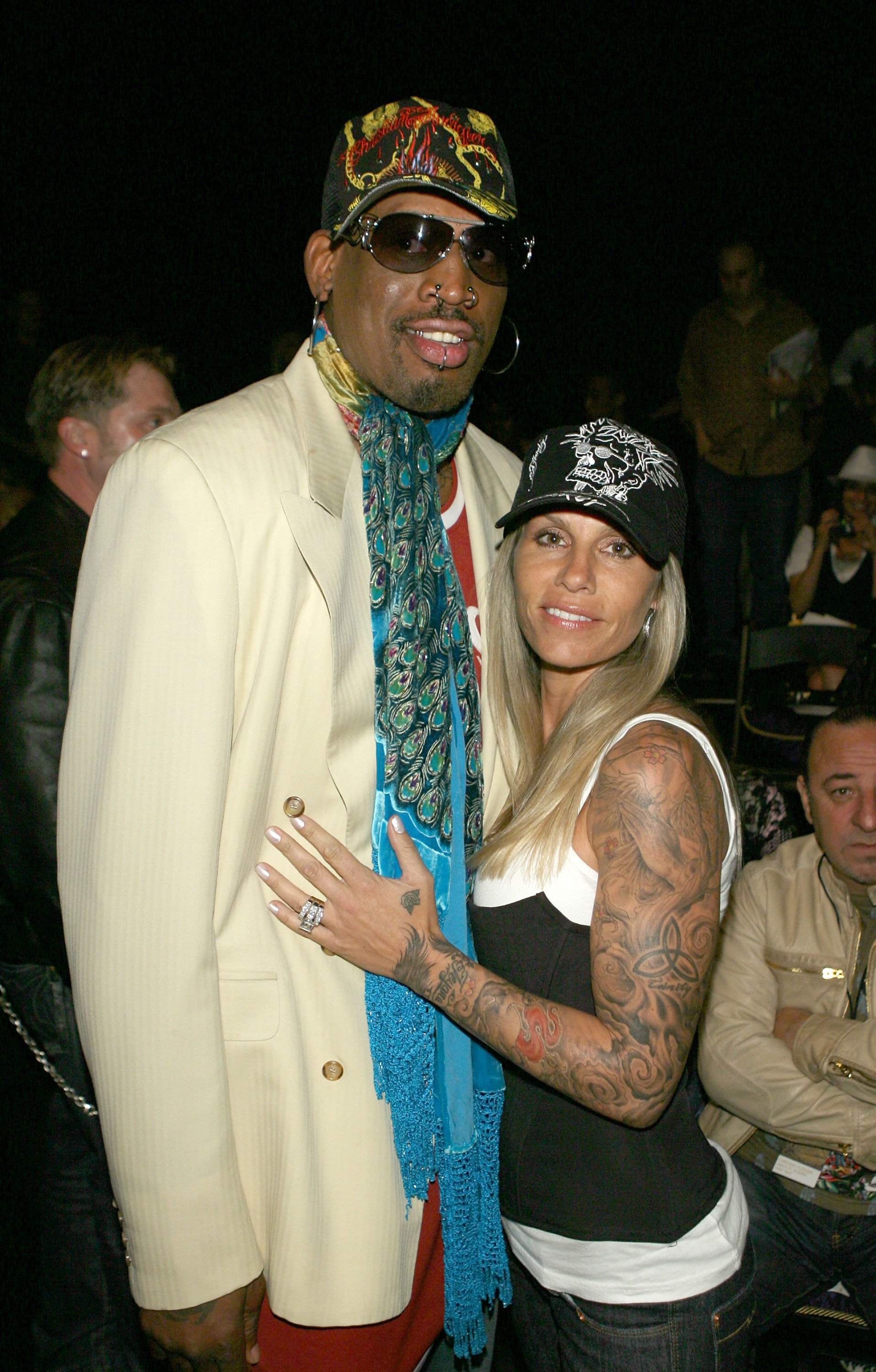 Dennis Rodman and Michelle Moyer at the Christian Audigier Fall 2007 fashion show on March 21, 2007 | Source: Getty Images