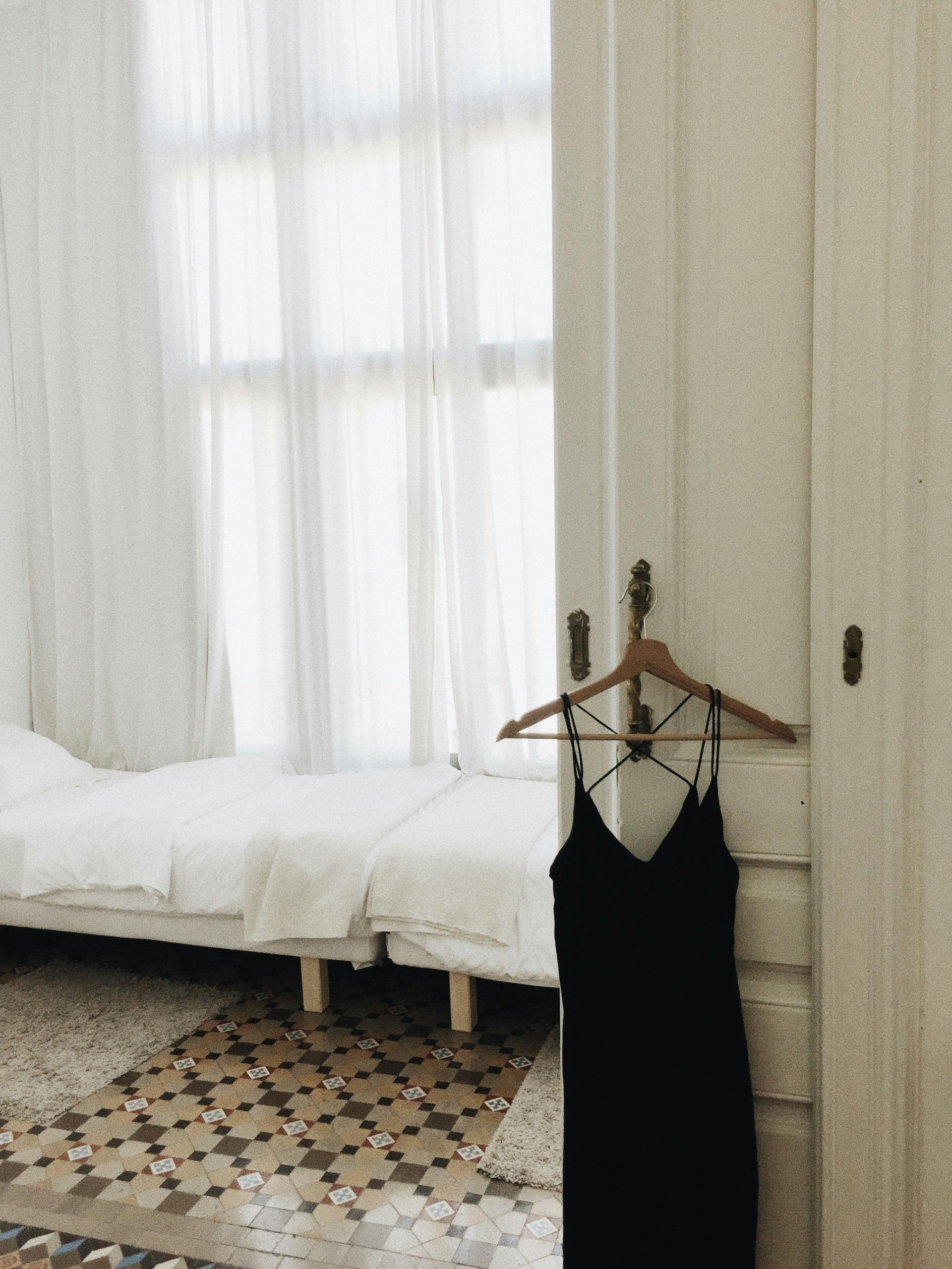 A black dress on a hanger | Source: Pexels