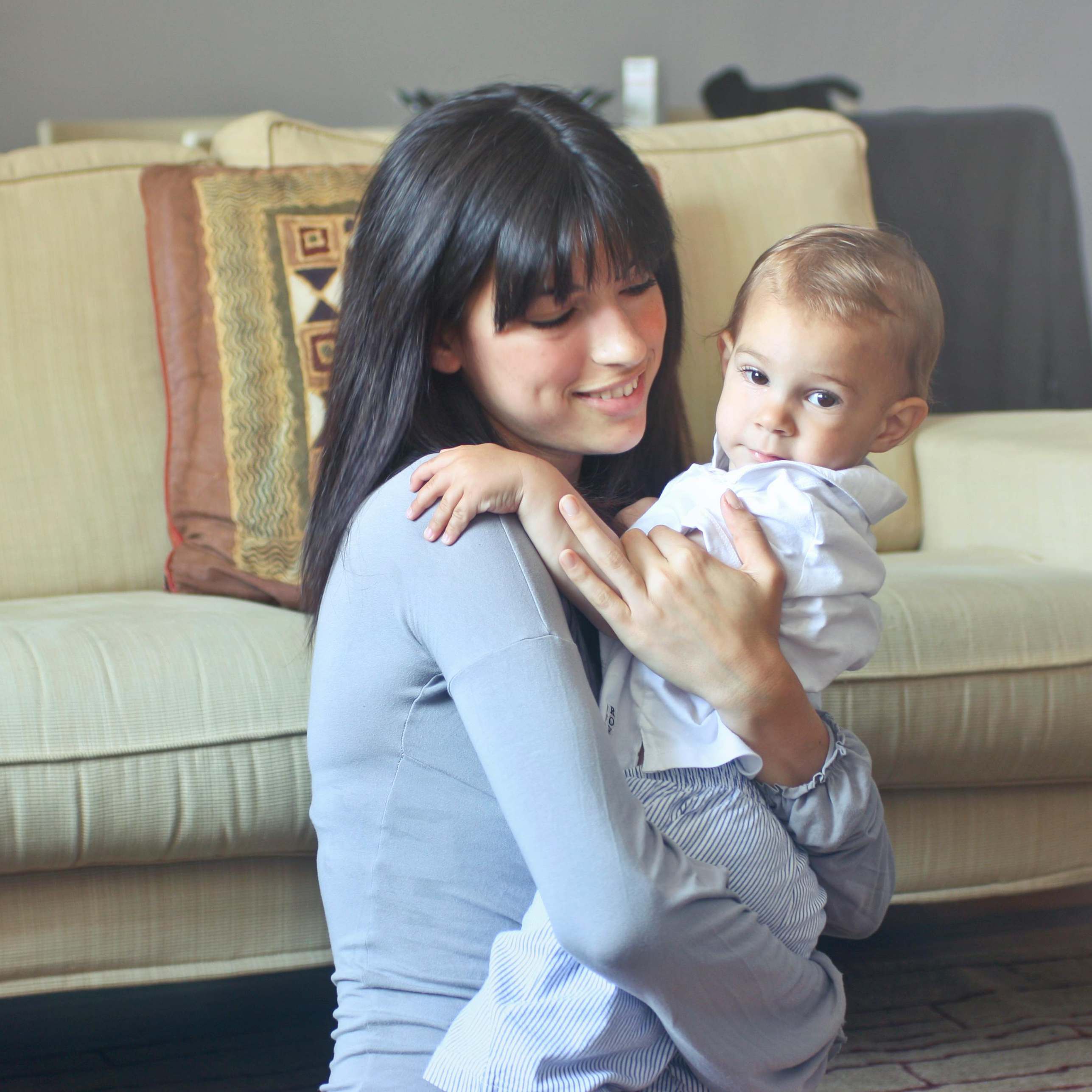 A woman holding a baby | Source: Pexels