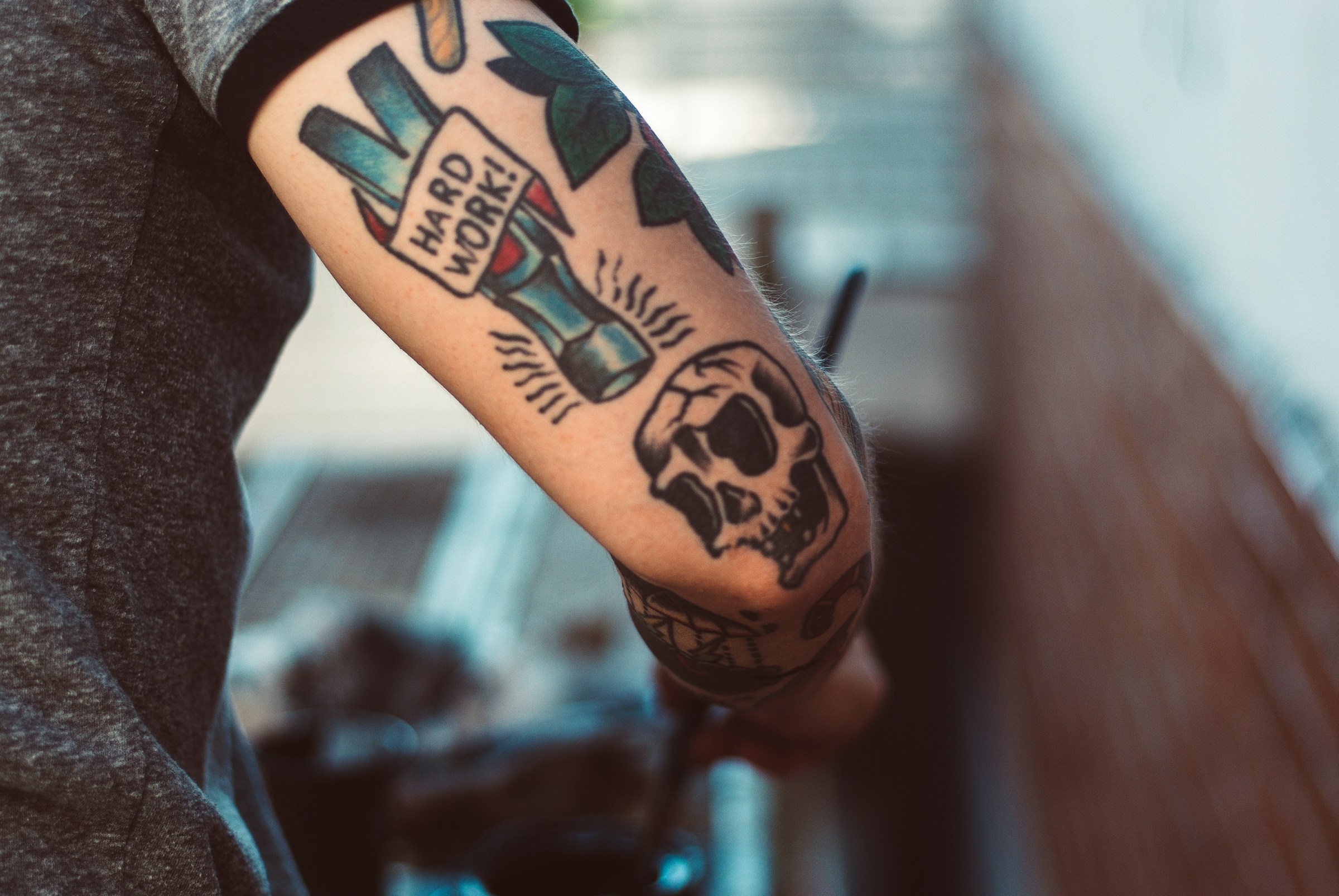 An arm with tattoos | Source: Pexels