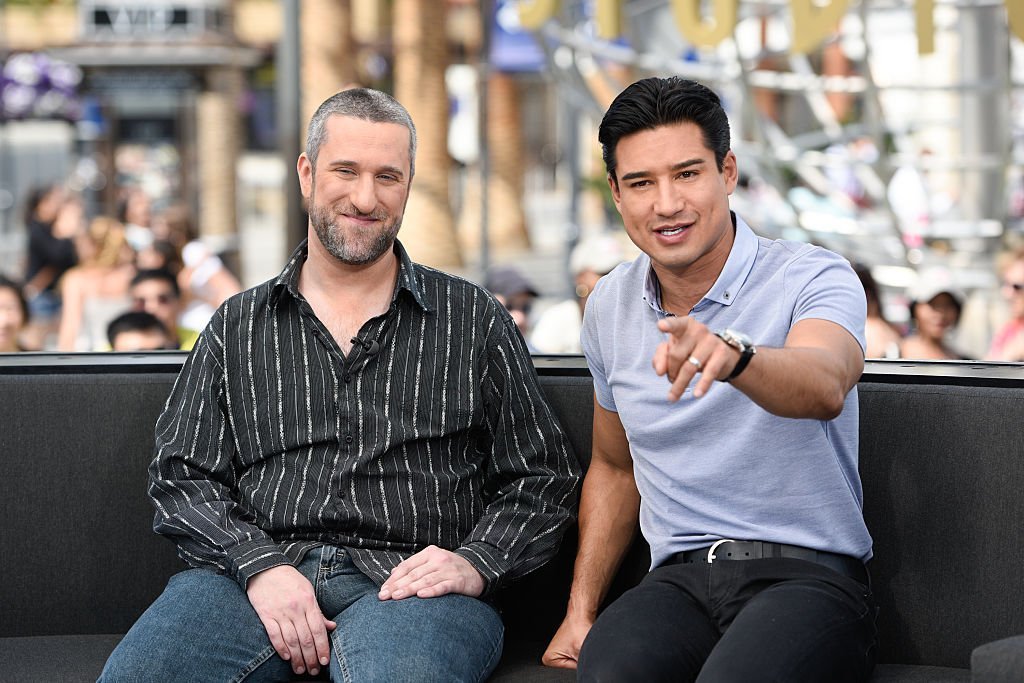 Dustin Diamond  and Mario Lopez visit "Extra" at Universal Studios Hollywood on May 16, 2016 in Universal City, California | Photo: GettyImages