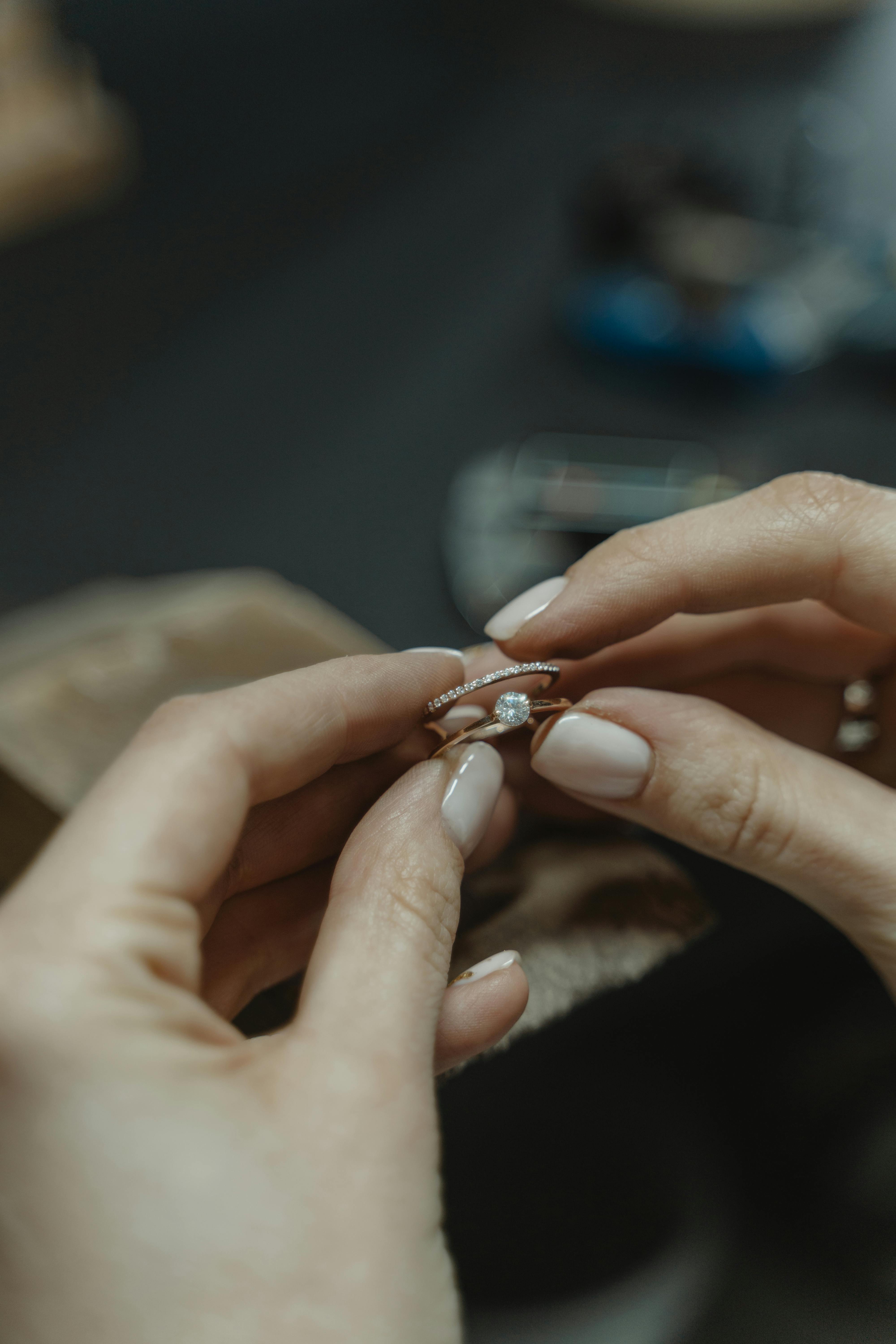 A person with nail polish in milky tones | Source: Pexels