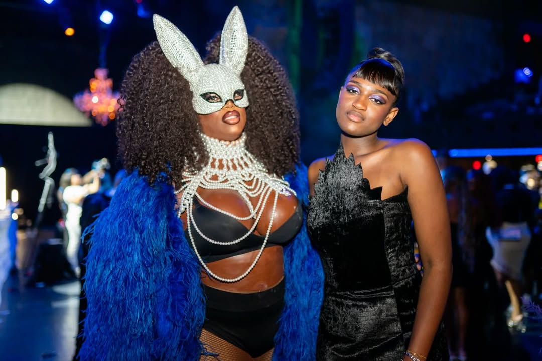 Zaya Wade stands beside a guest wearing a crystal-studded bunny mask and pearl-adorned ensemble during the masquerade-themed Translatable Ball. | Source: Instagram/translatableproject