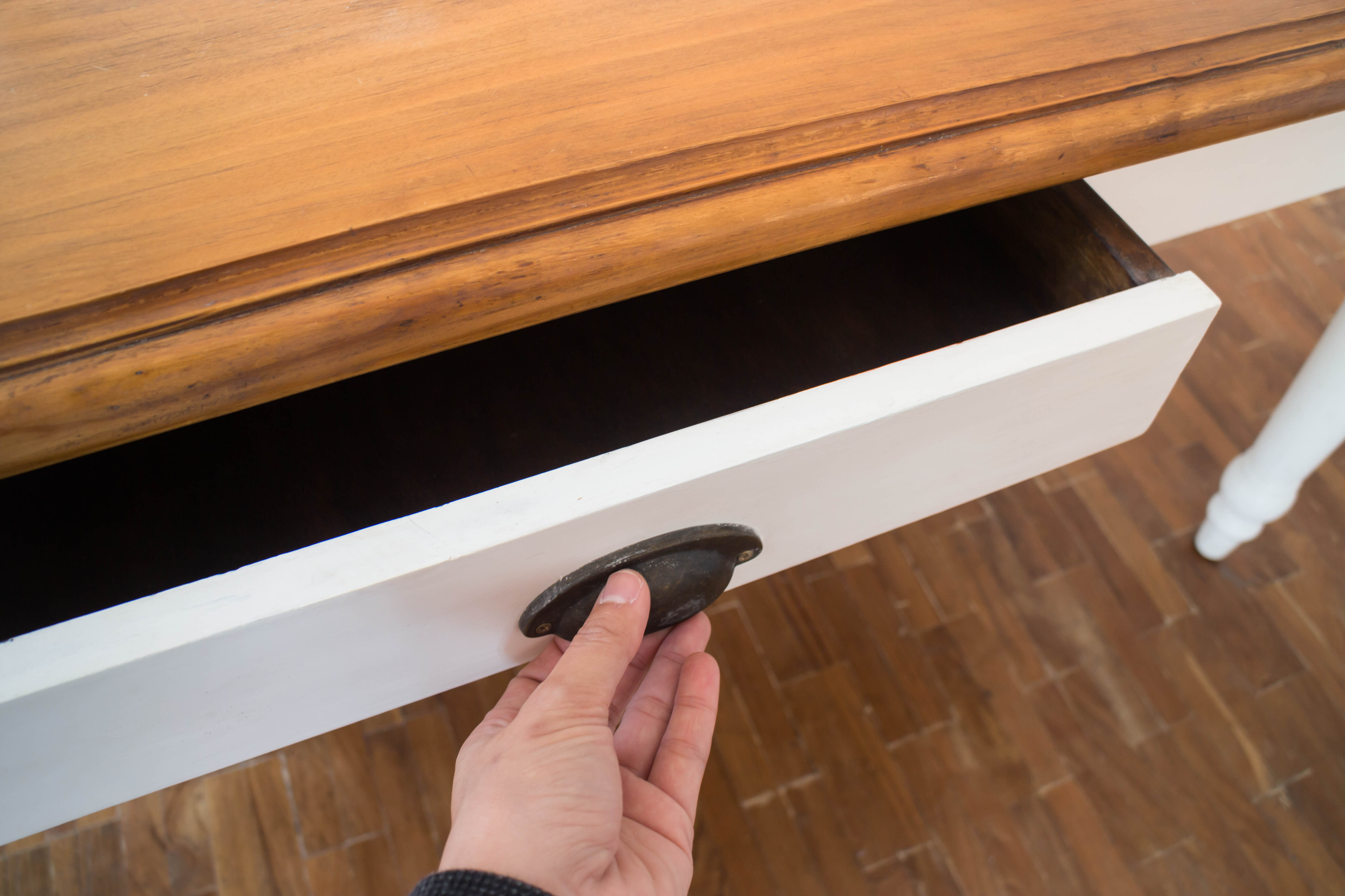 Hand open drawer box | Source: Shutterstock