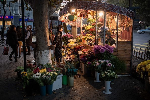 A picture of a man standing by a flower shop in Yerevan, Armenia | Photo: Getty Images