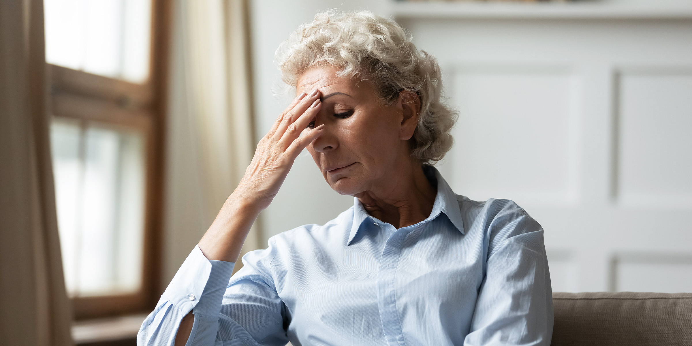 A woman experiencing pain | Source: Shutterstock
