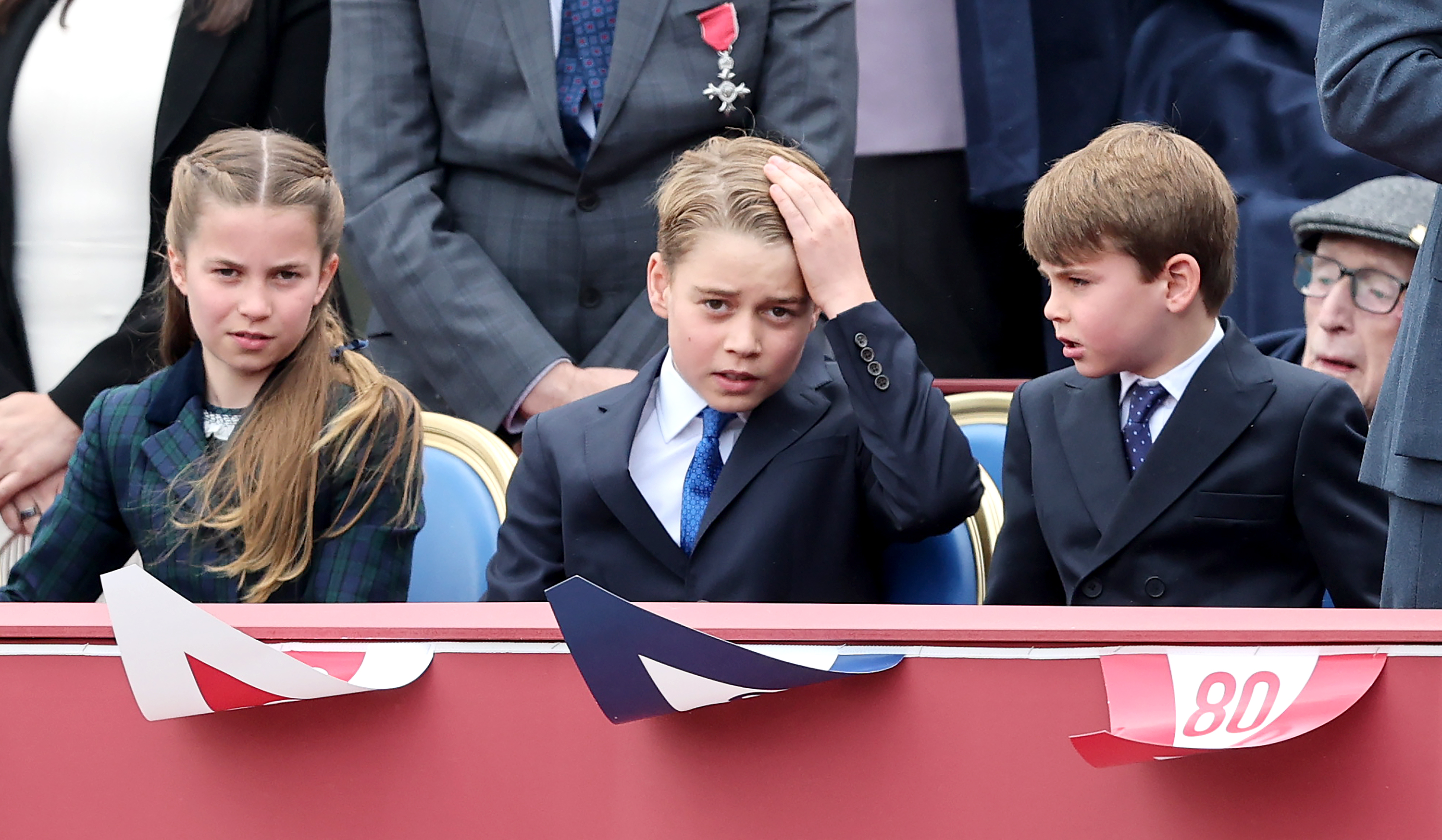 Princess Charlotte sits with quiet reverence at the 80th anniversary of VE Day on 5 May 2025. Flanked by her brothers, Prince George and Prince Louis, she takes part in moving tributes to those who fought in World War II, her solemn gaze capturing the gravity of the day.