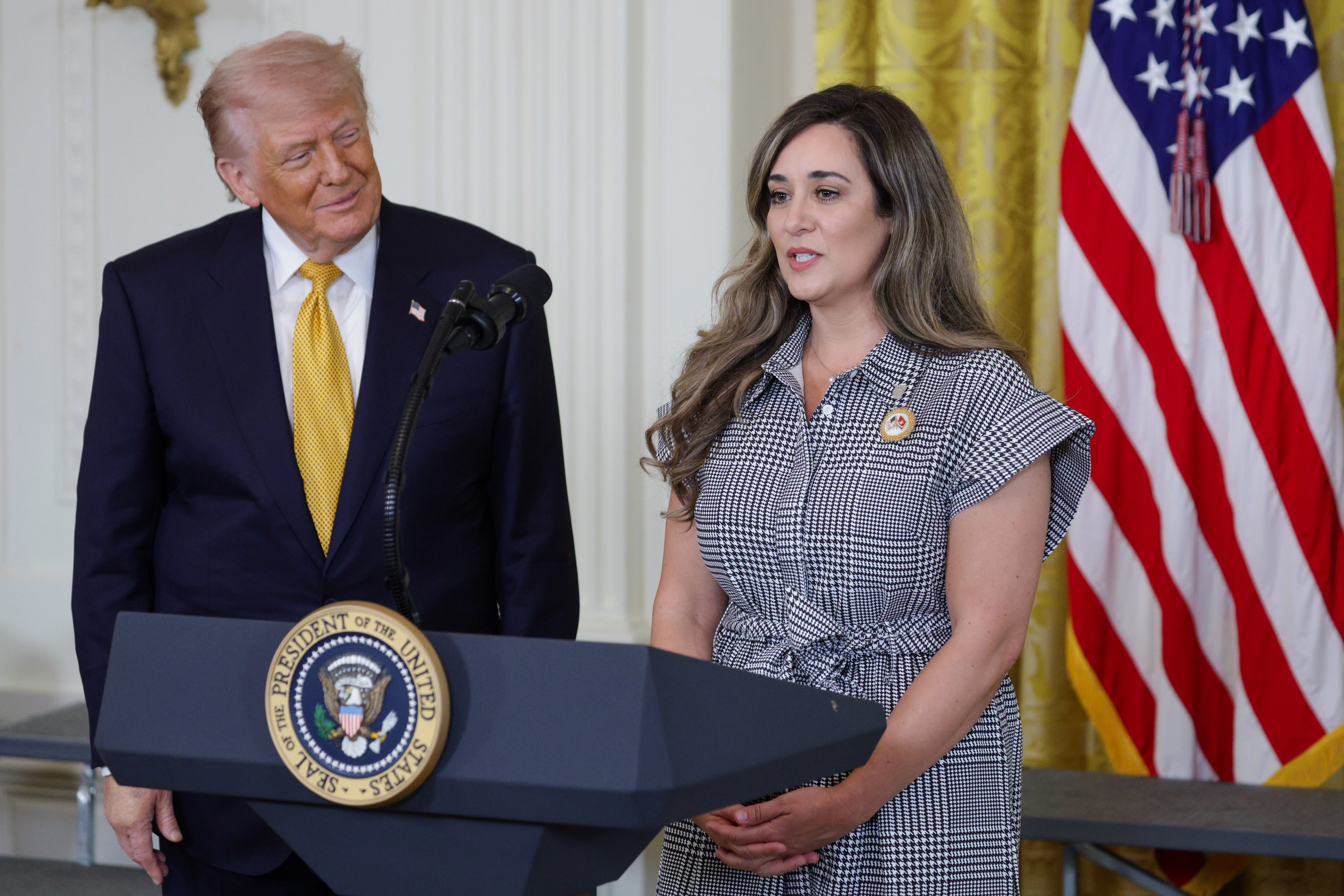 Military spouse Brittany Stevenson speaks alongside Donald Trump during a military mothers celebration in the East Room of the White House on May 6, 2026, in Washington, DC | Source: Getty Images