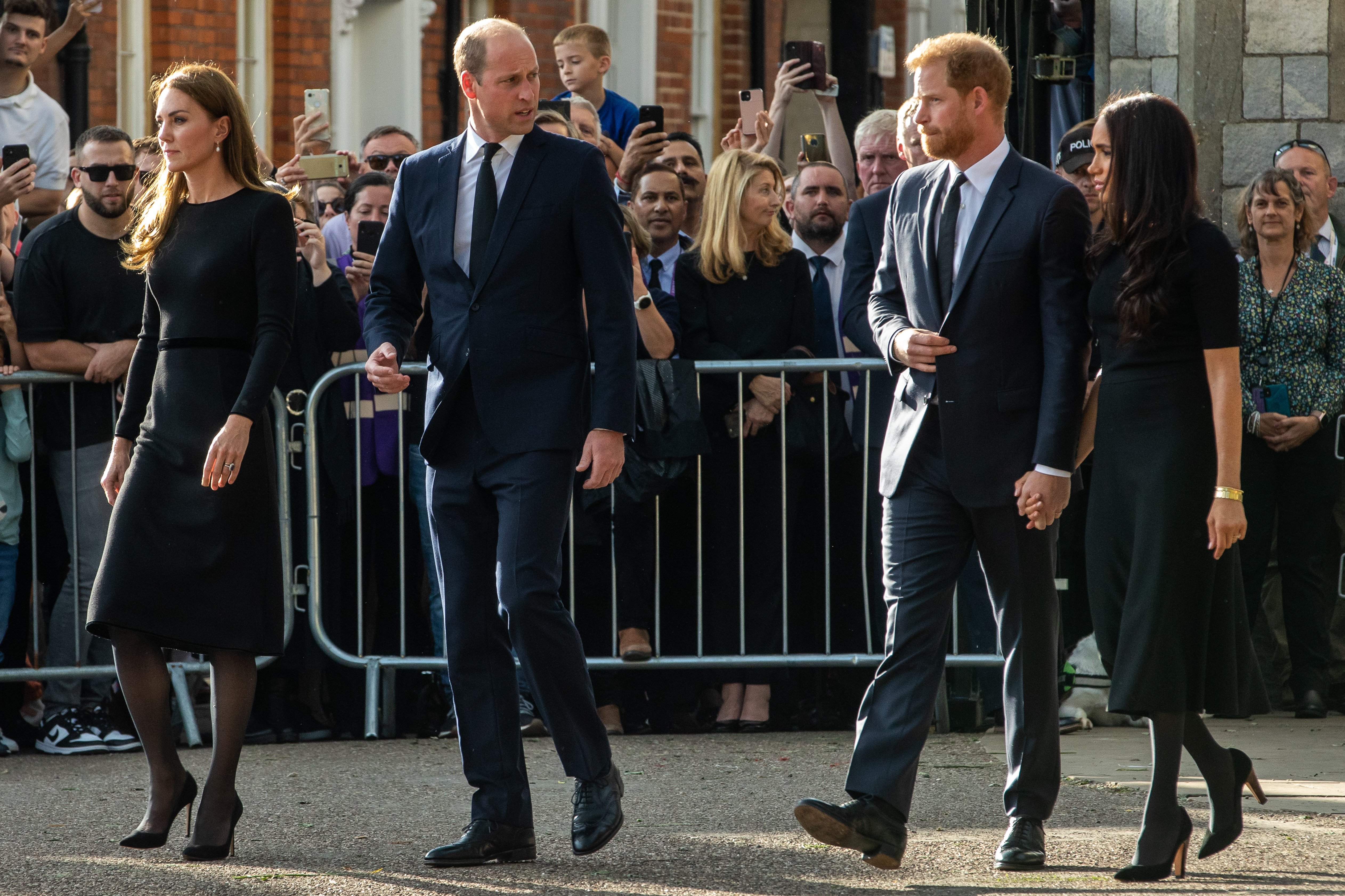 Prince William and Catherine, the new Prince and Princess of Wales, accompanied by Prince Harry and Meghan, the Duke and Duchess of Sussex, proceed to greet well-wishers outside Windsor Castle on 10th September 2022 in Windsor, United Kingdom | Source: Getty Images 